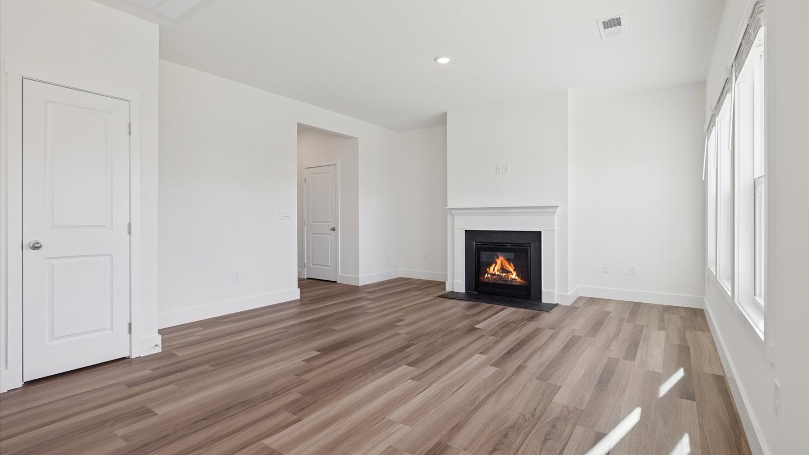 Open concept living, dining, and kitchen space