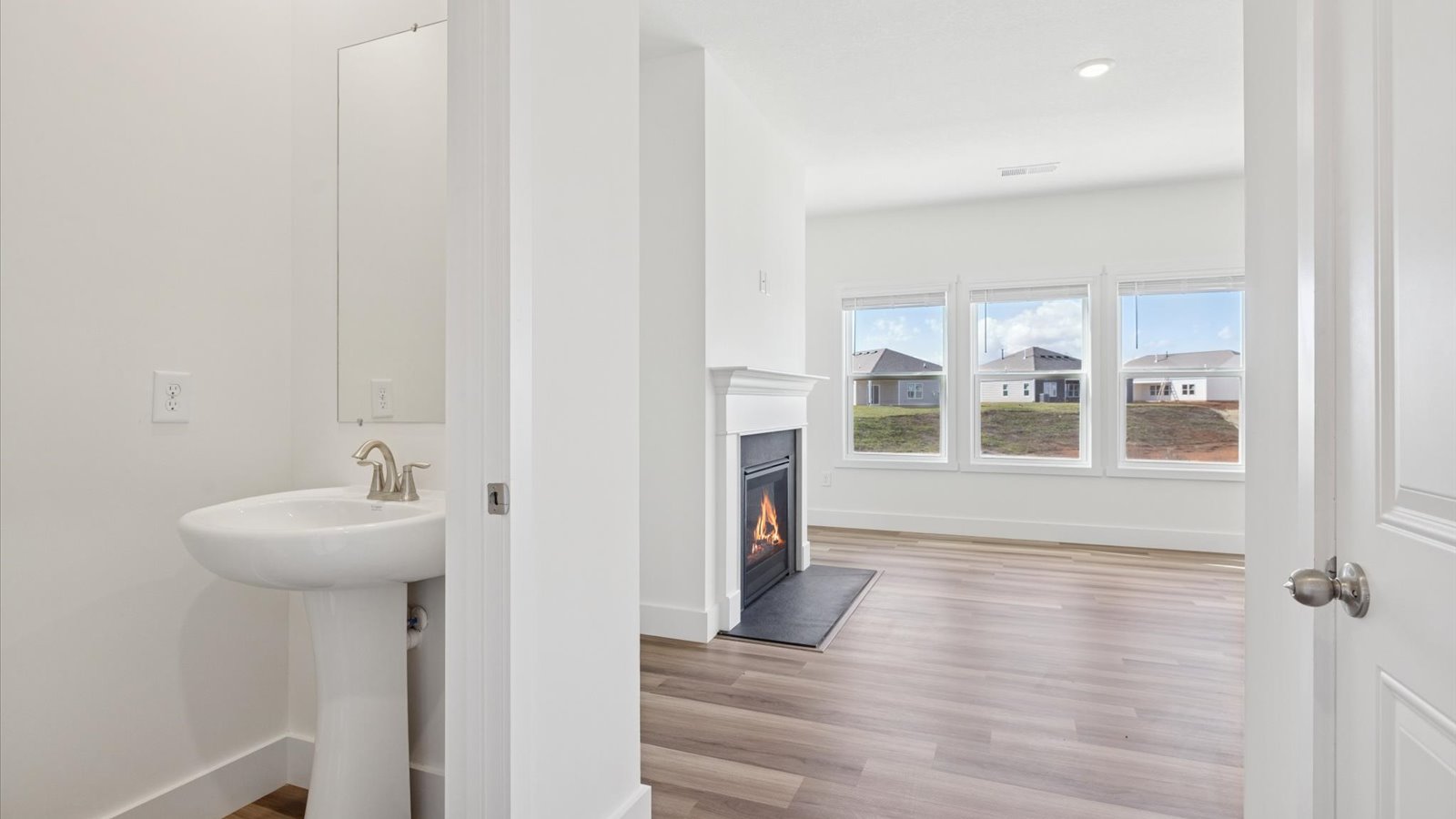 Open concept living, dining, and kitchen space