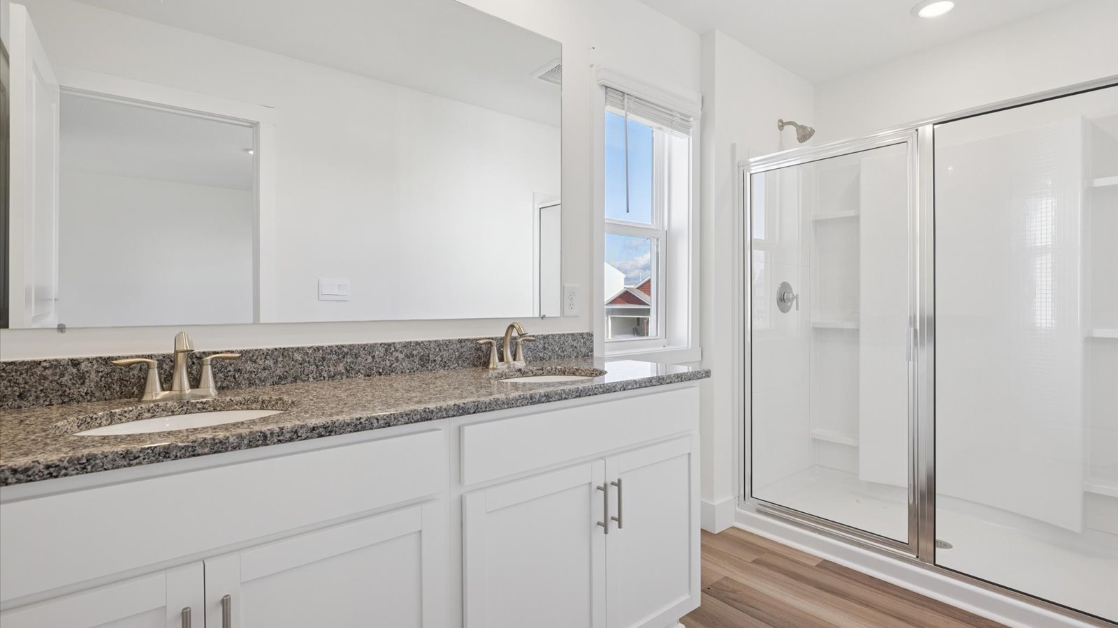 Primary bathroom with luxurious shower and built in storage