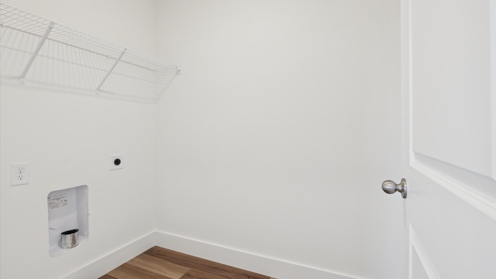 Laundry room and utility closet space with extra storage