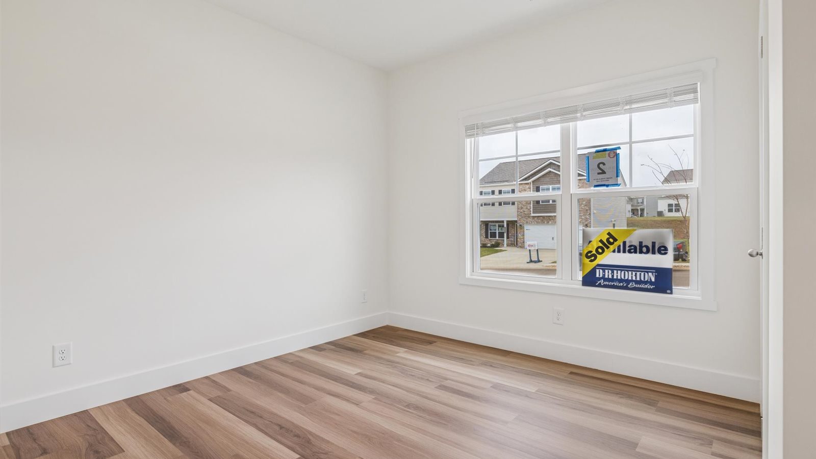Primary bedroom with private attached bathroom and walk-in closet