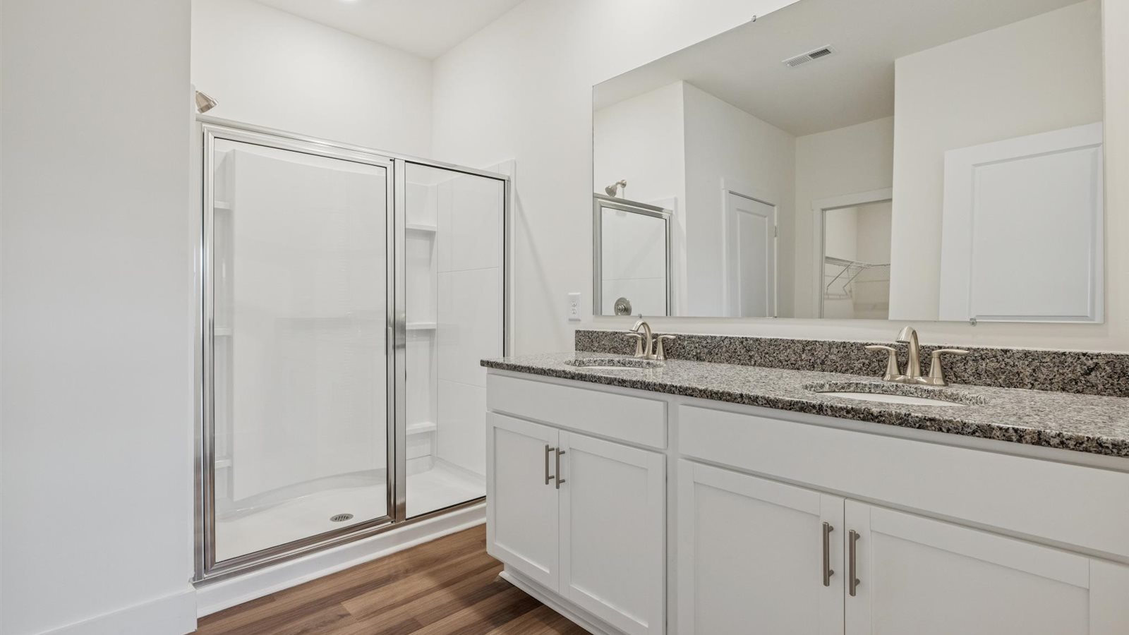 Primary bathroom with luxurious shower and built in storage