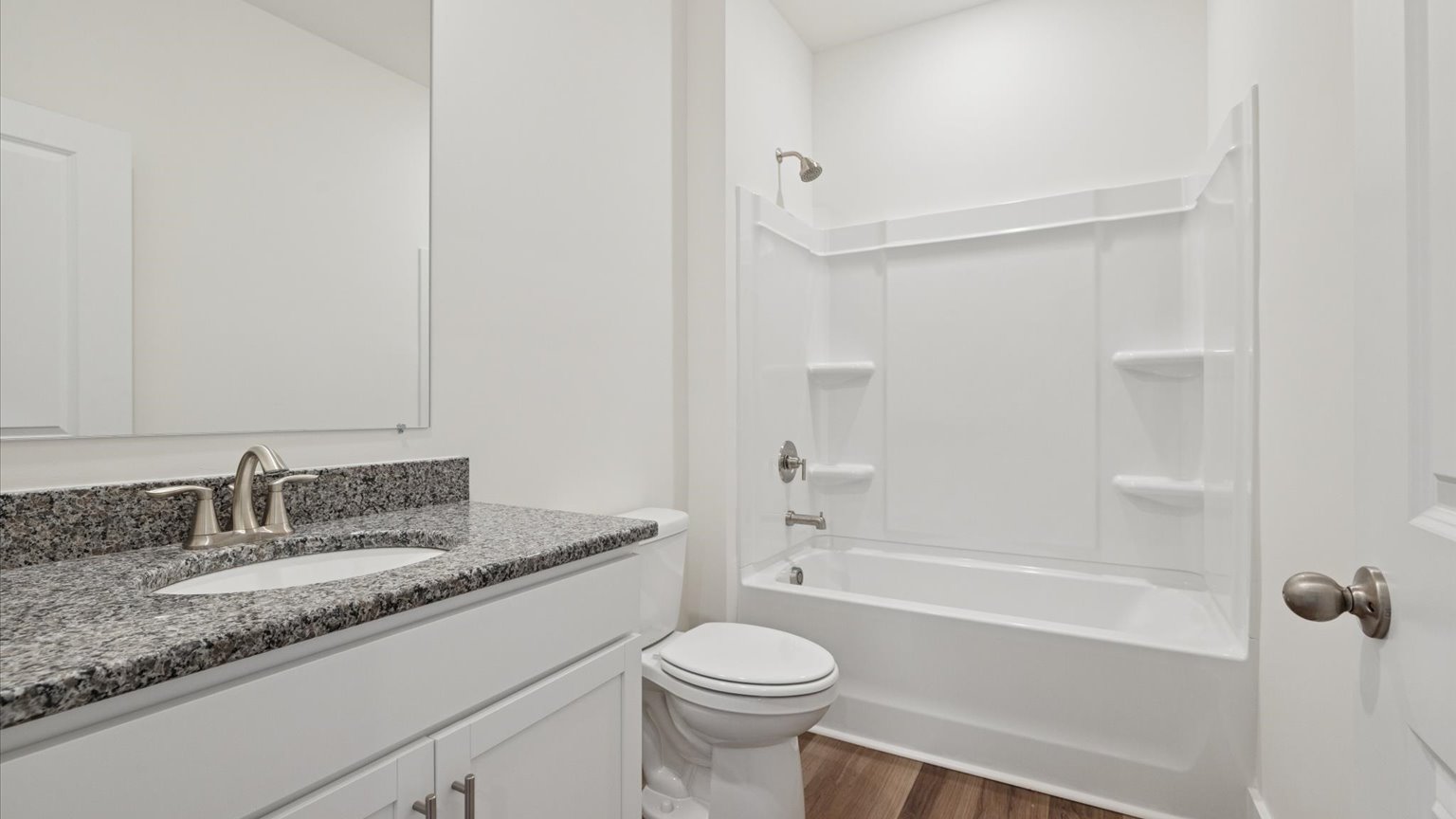 Guest bathroom with built in vanity and combination bathtub shower