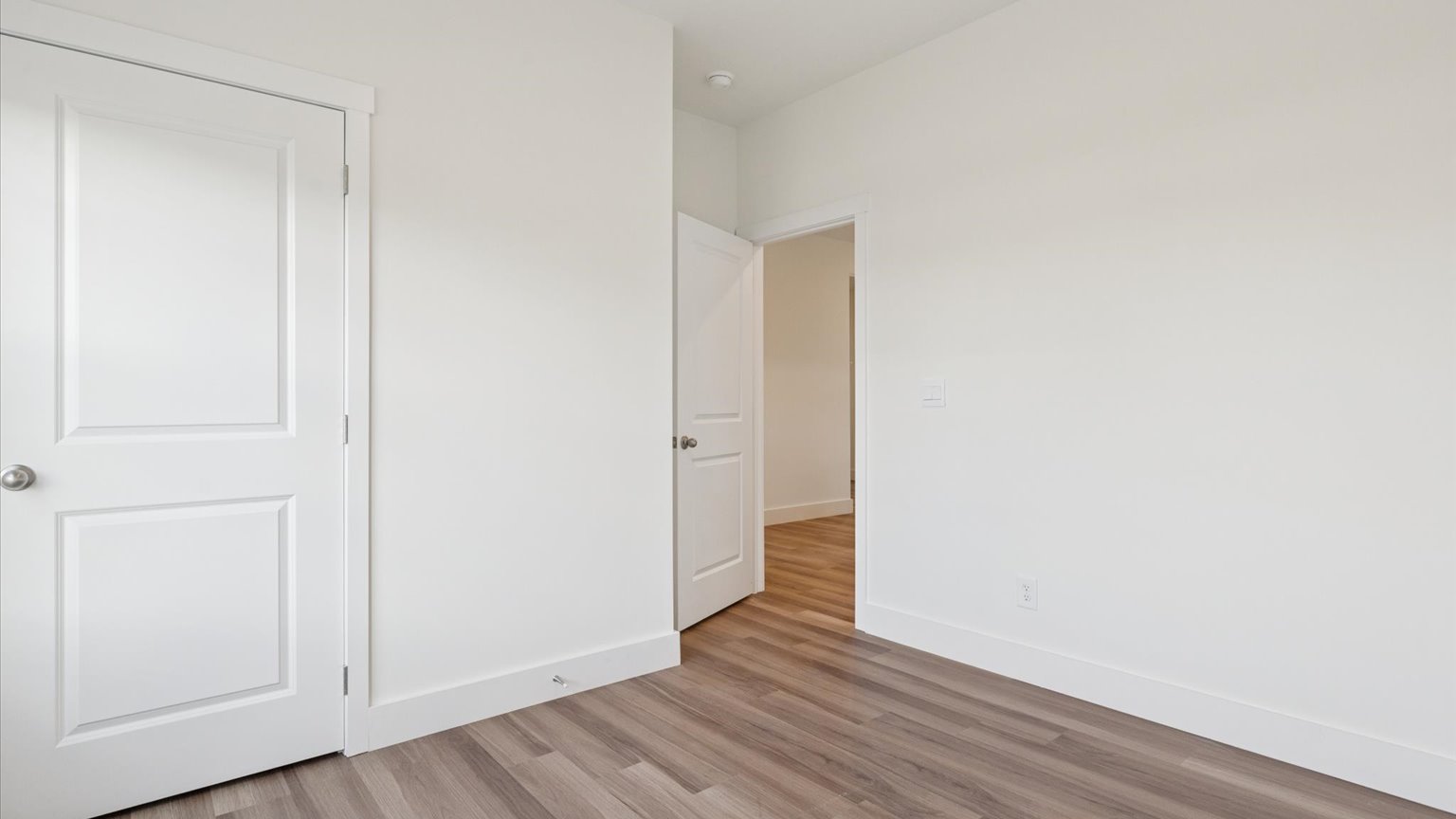 Bedroom with ample natural light and carpet floors