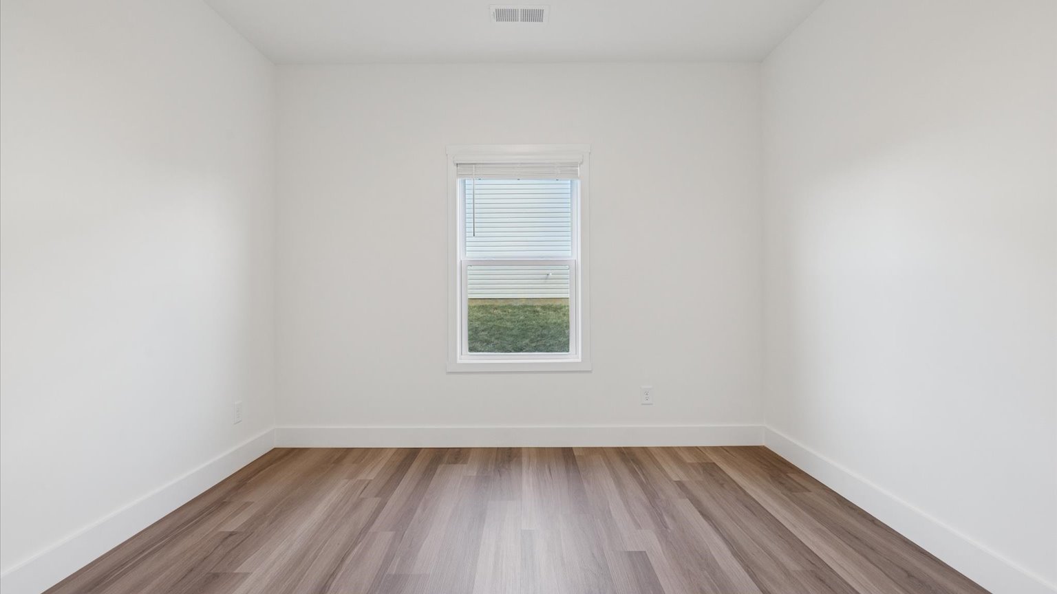 Bedroom with ample natural light and carpet floors