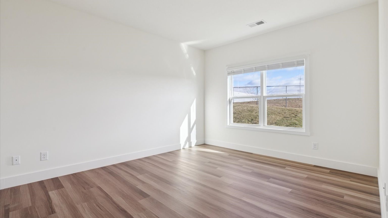 Primary bedroom with private attached bathroom and walk-in closet
