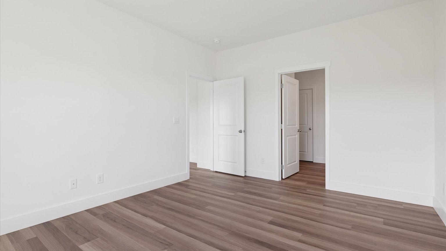 Primary bedroom with private attached bathroom and walk-in closet