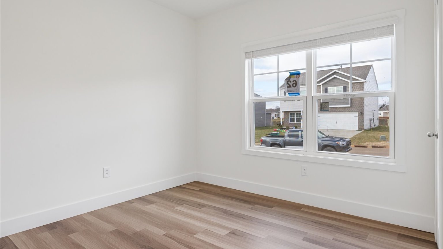 Primary bedroom with private attached bathroom and walk-in closet