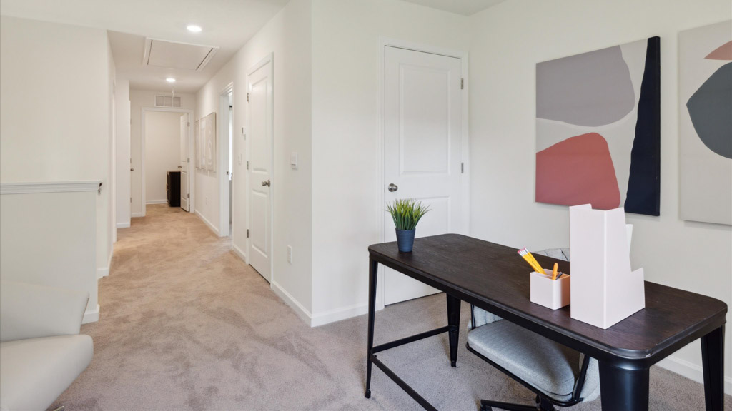 Bedroom with ample natural light and carpet floors