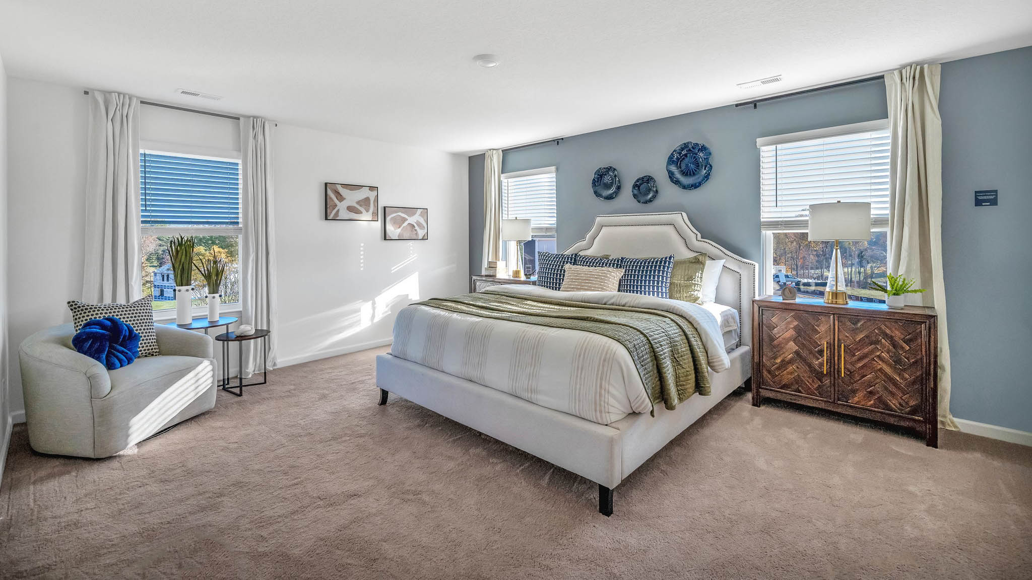 Primary bedroom with private attached bathroom and walk-in closet