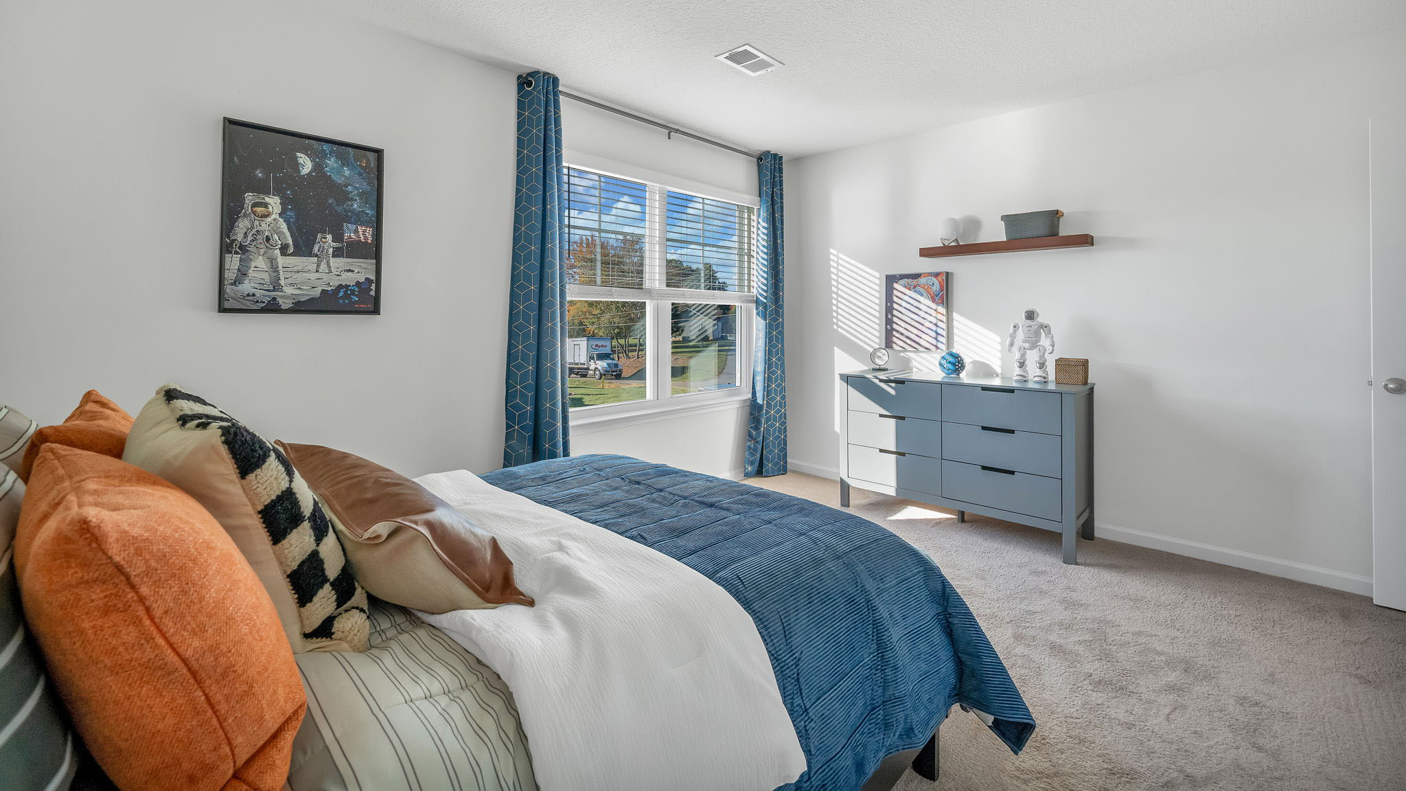 Bedroom with ample natural light and carpet floors