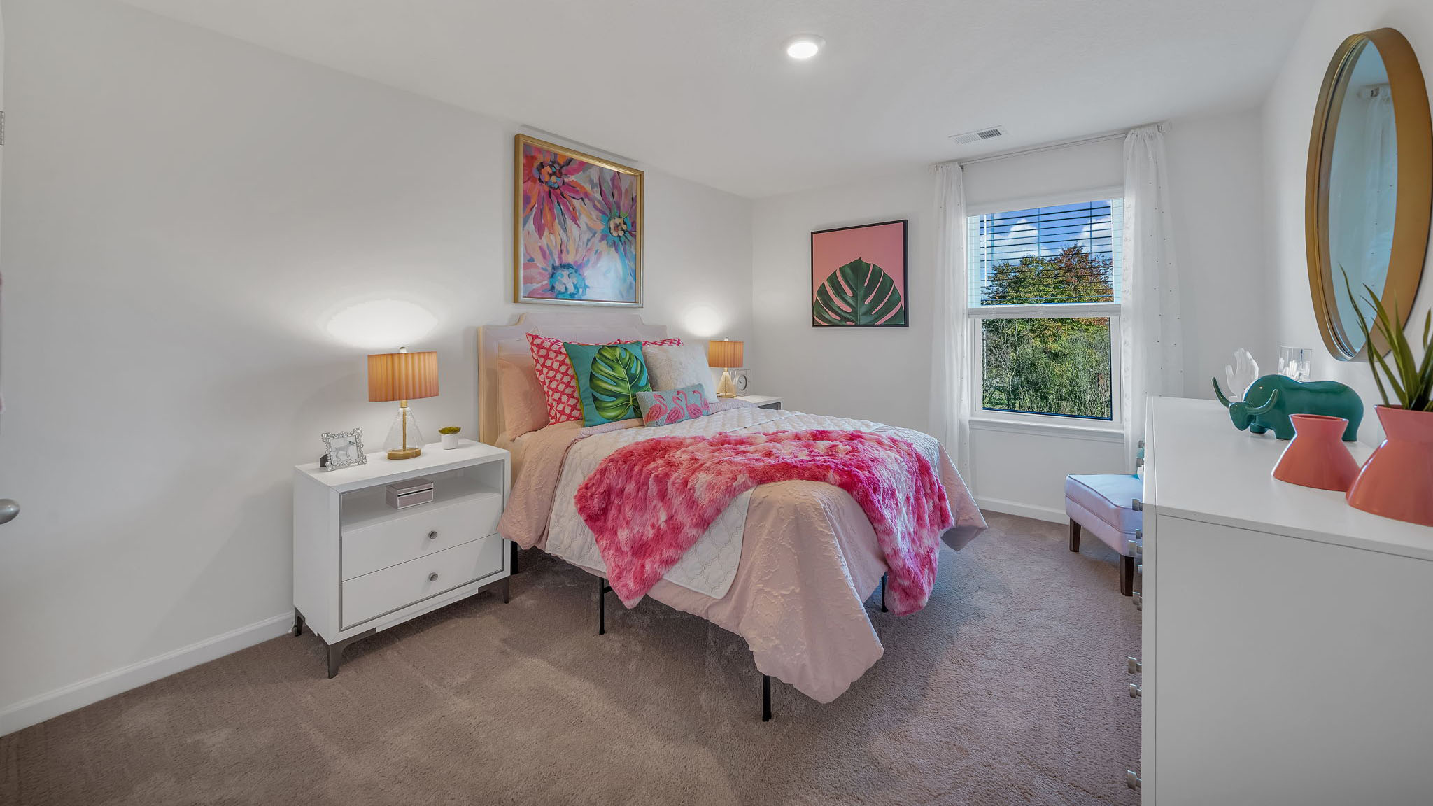Bedroom with ample natural light and carpet floors