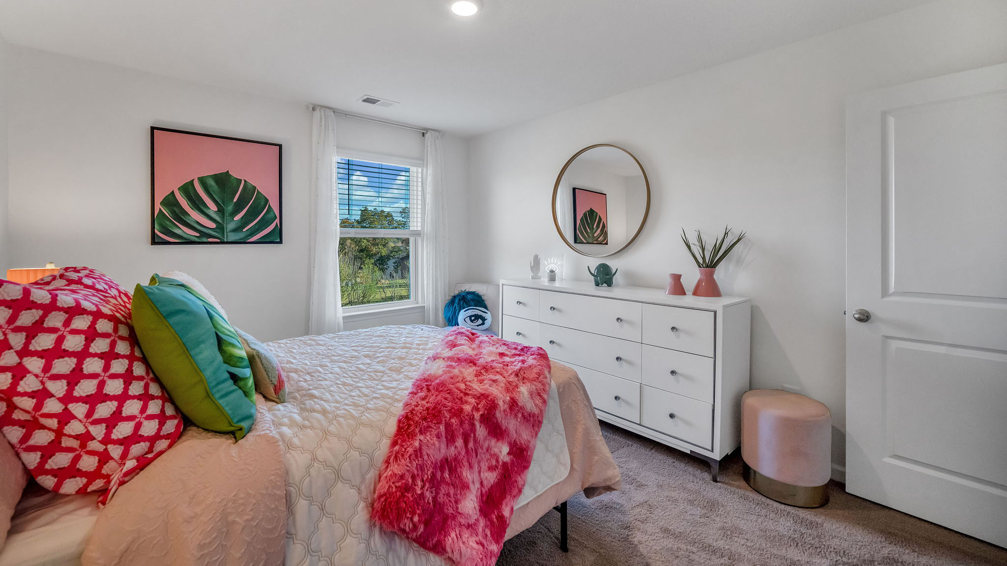 Bedroom with ample natural light and carpet floors