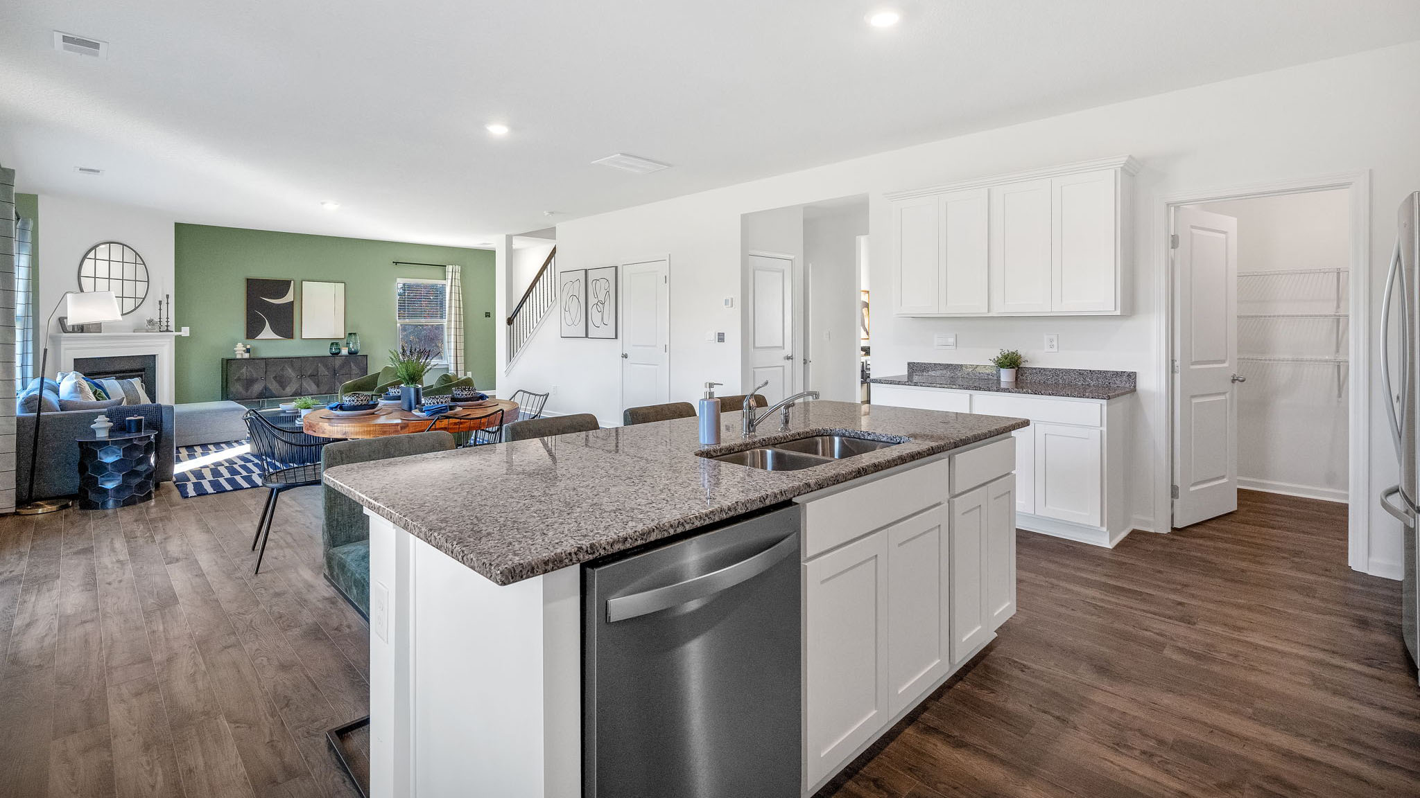 Open concept living, dining, and kitchen space