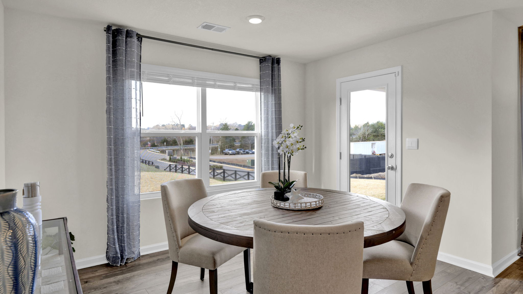 Open concept living, dining, and kitchen space