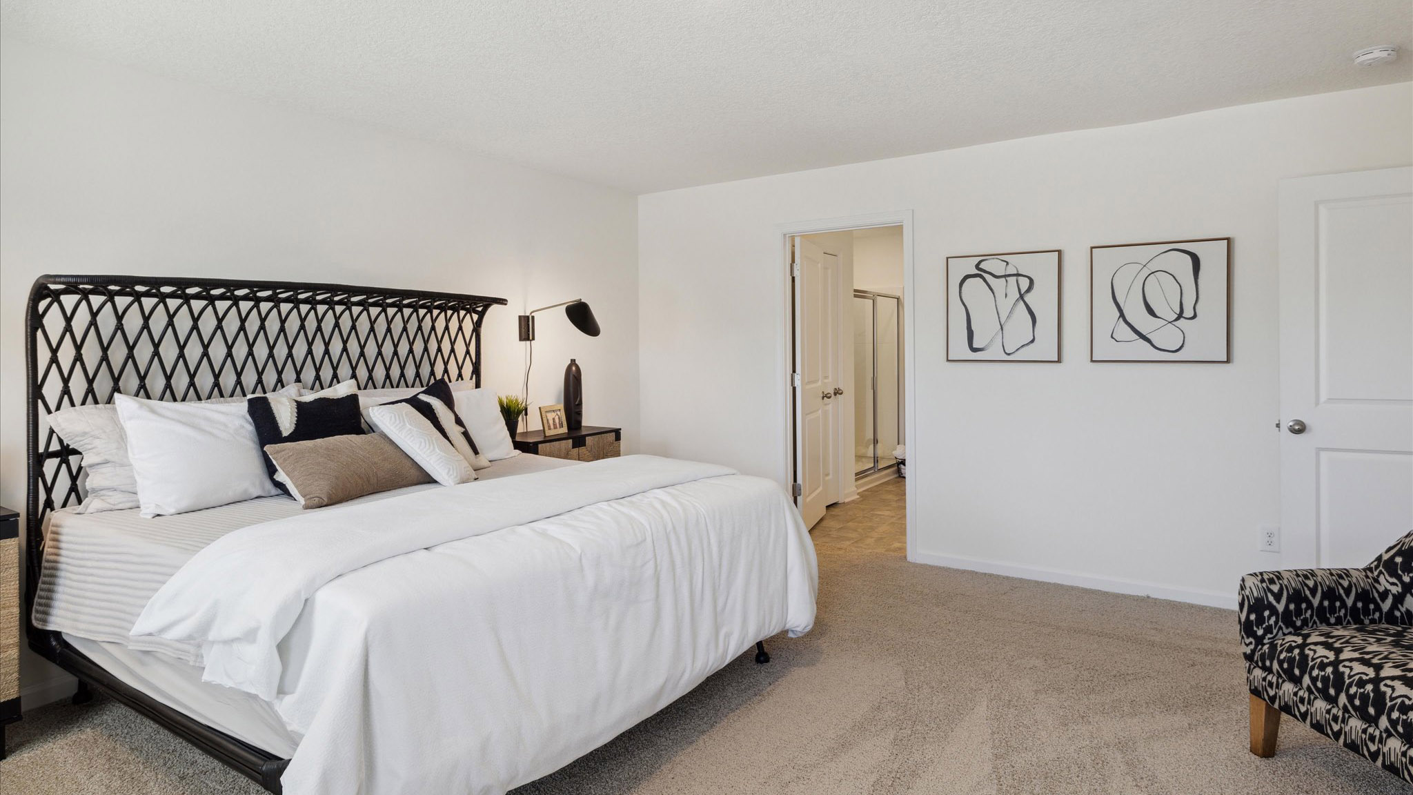 Bedroom with ample natural light and carpet floors