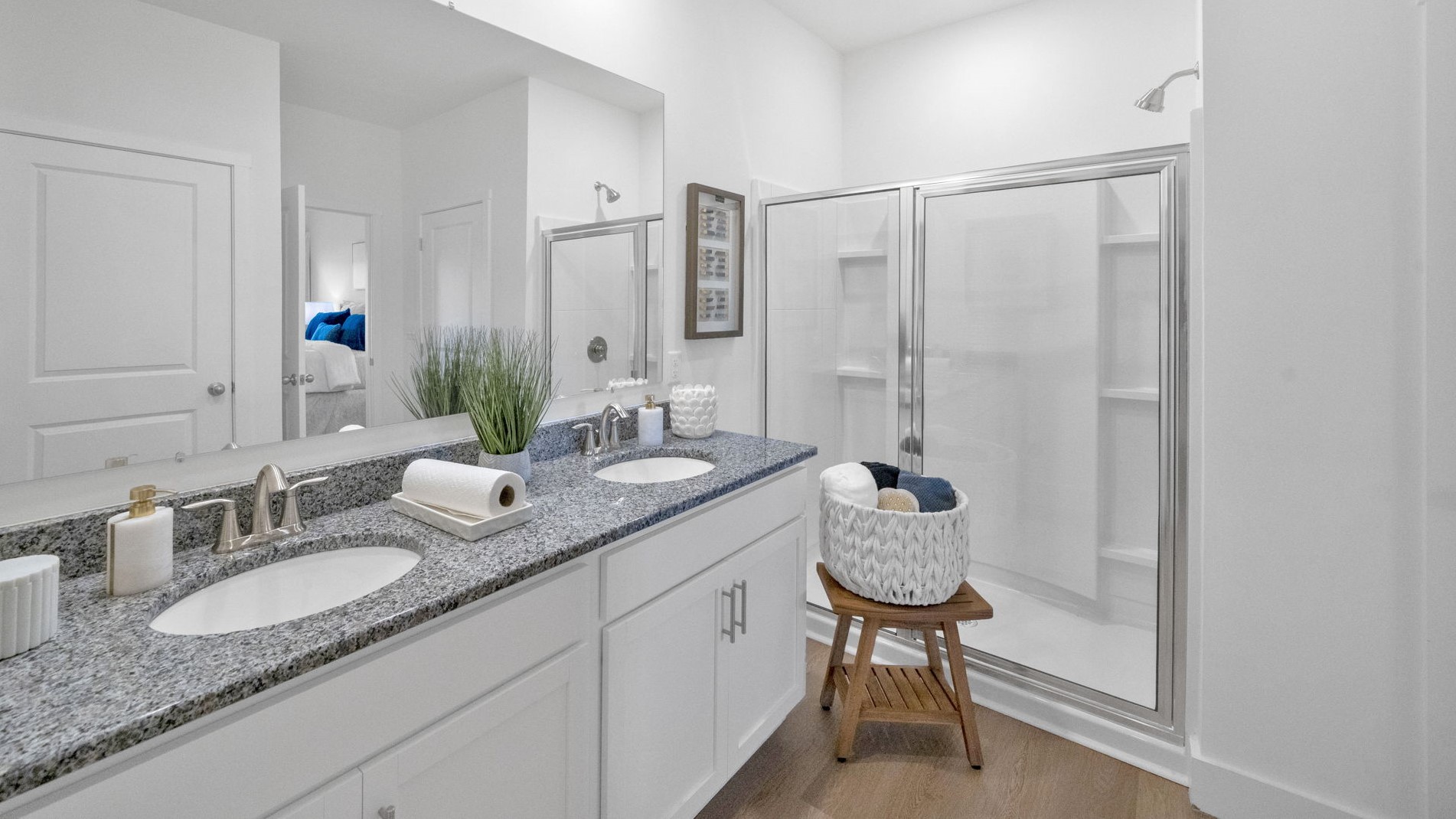 Primary bathroom with double vanity and walk-in shower