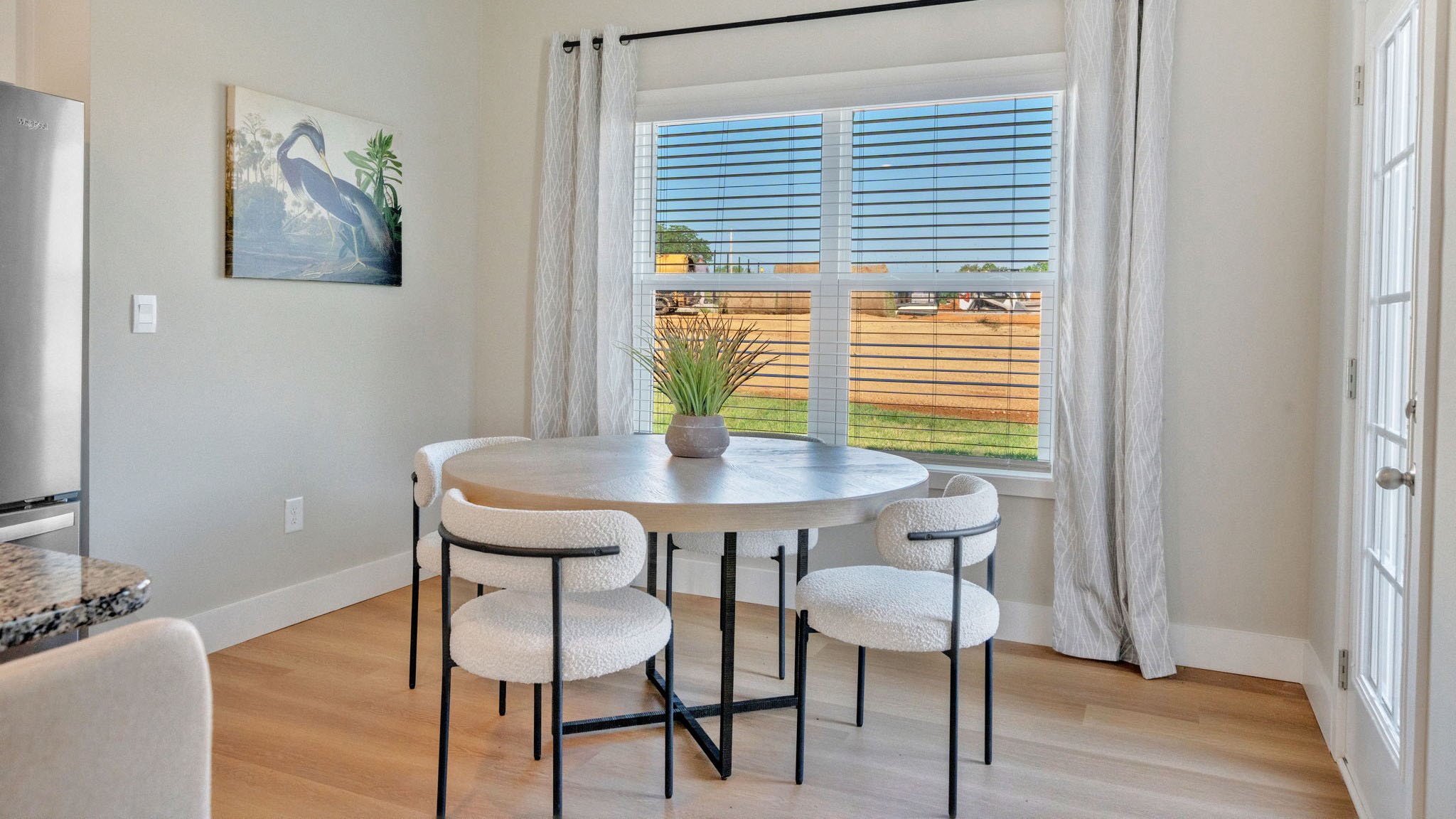 Open concept living, dining, and kitchen space