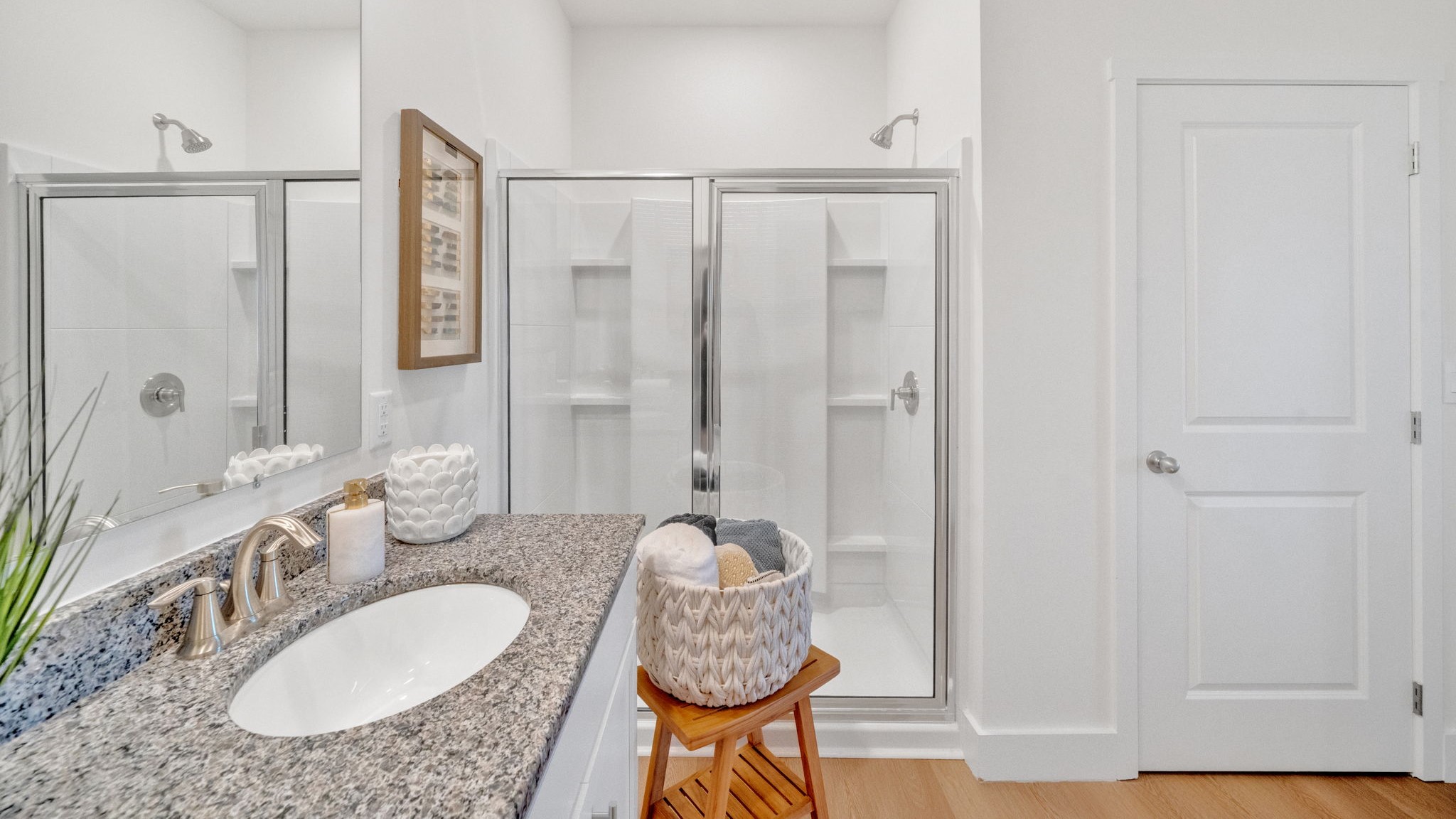 Primary bathroom with double vanity and walk-in shower