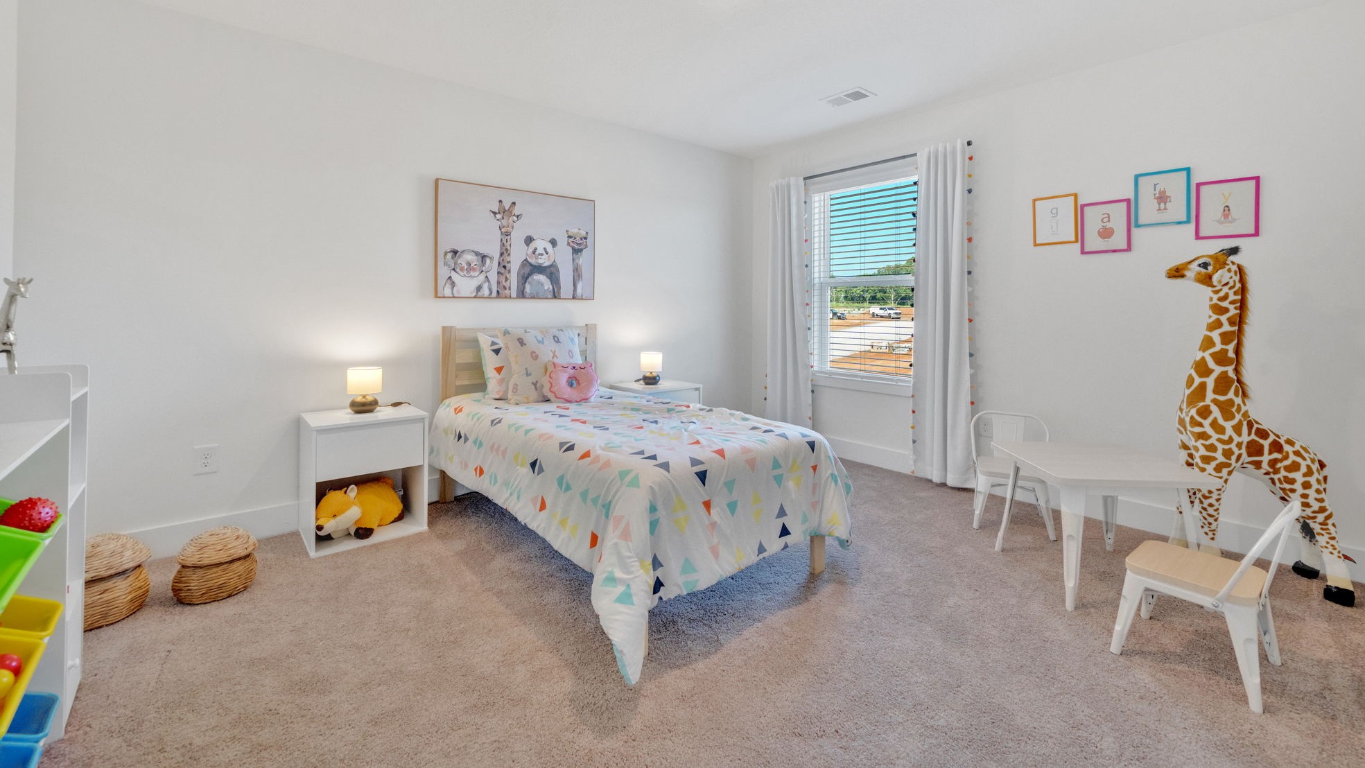 Bedroom with ample natural light and carpet floors