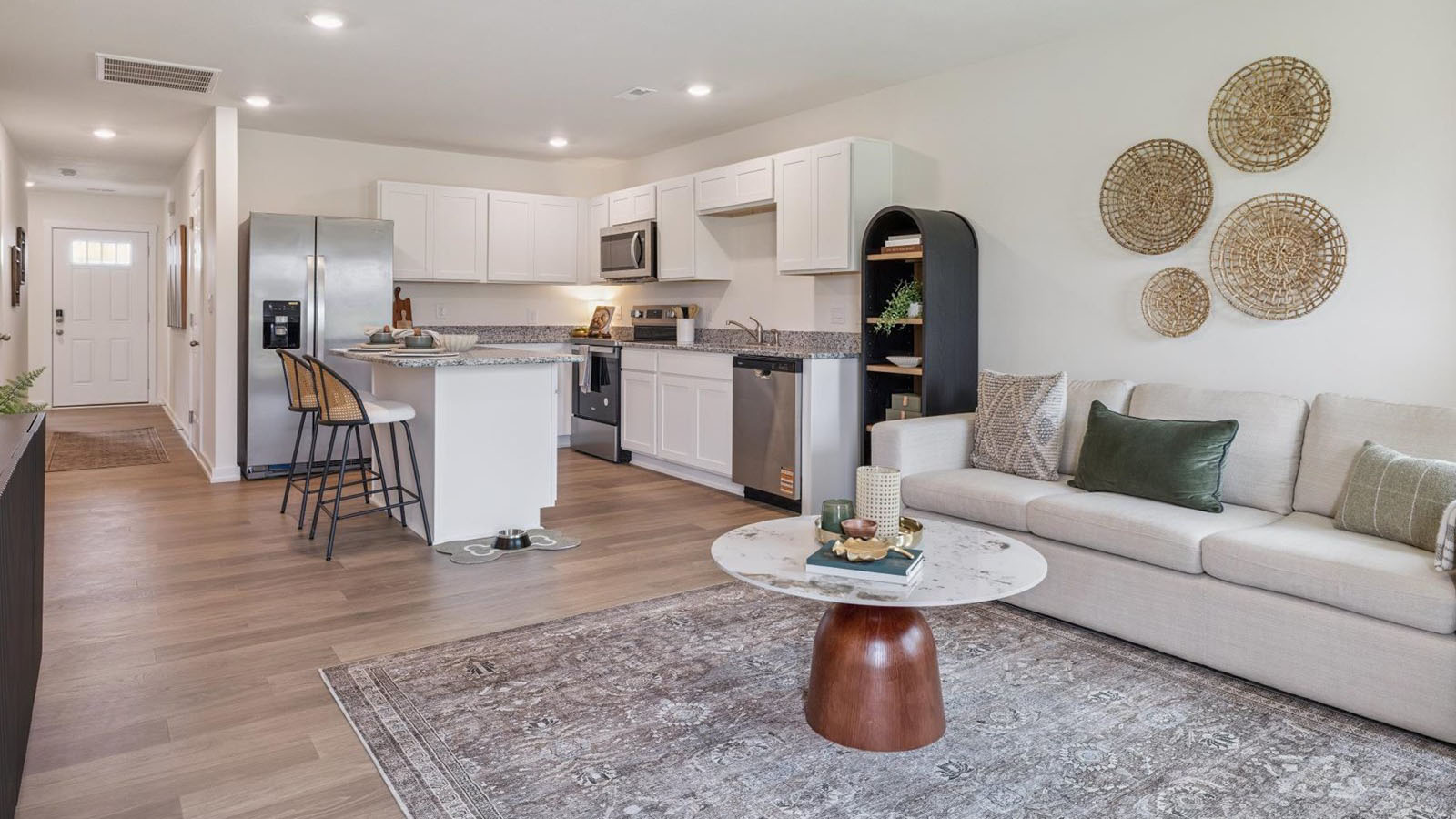 Spacious living and great  room space with light allowing windows