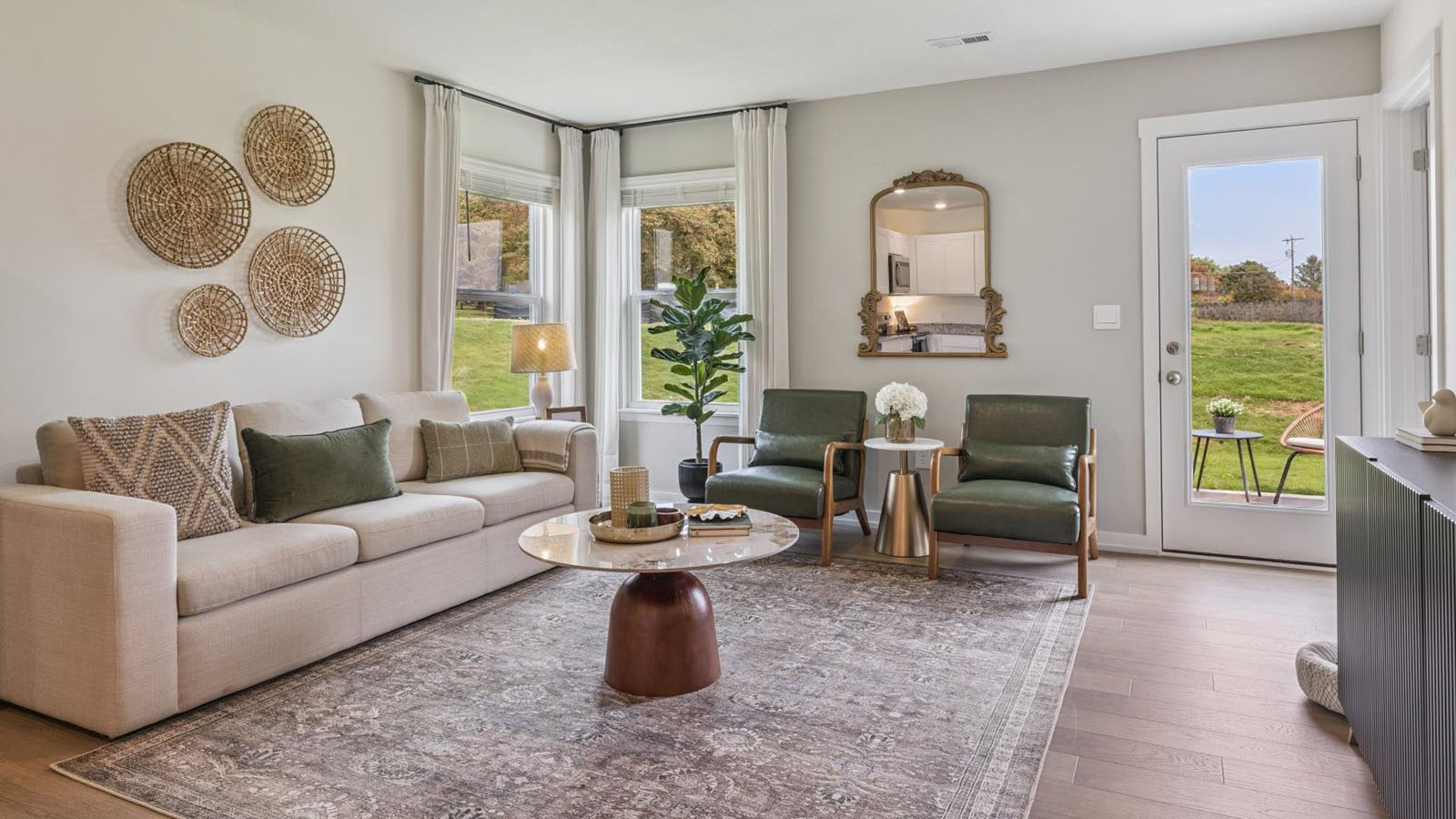 Spacious living and great  room space with light allowing windows