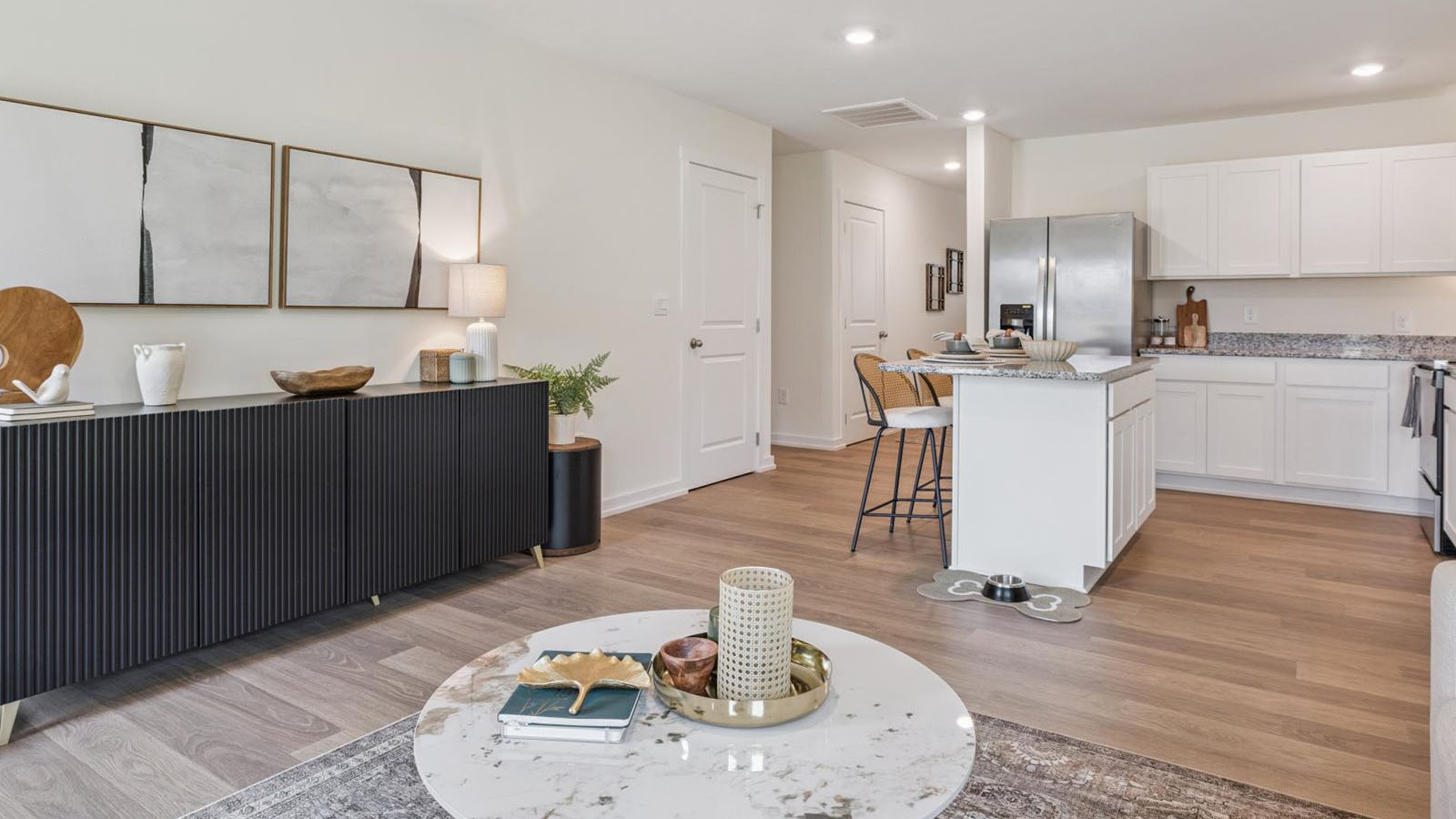 Spacious living and great  room space with light allowing windows