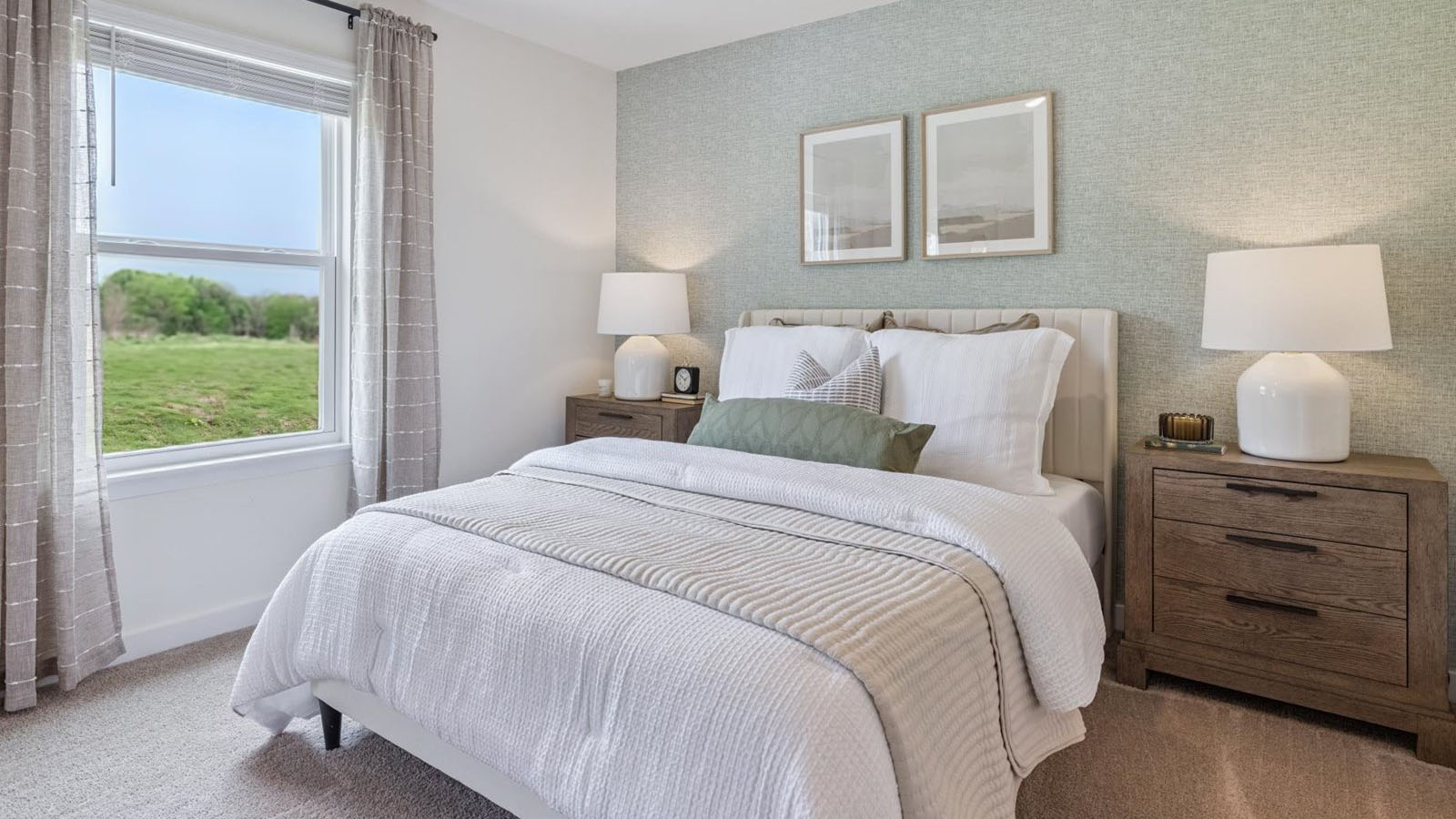 Primary bedroom with plush carpet floors and double light allowing windows