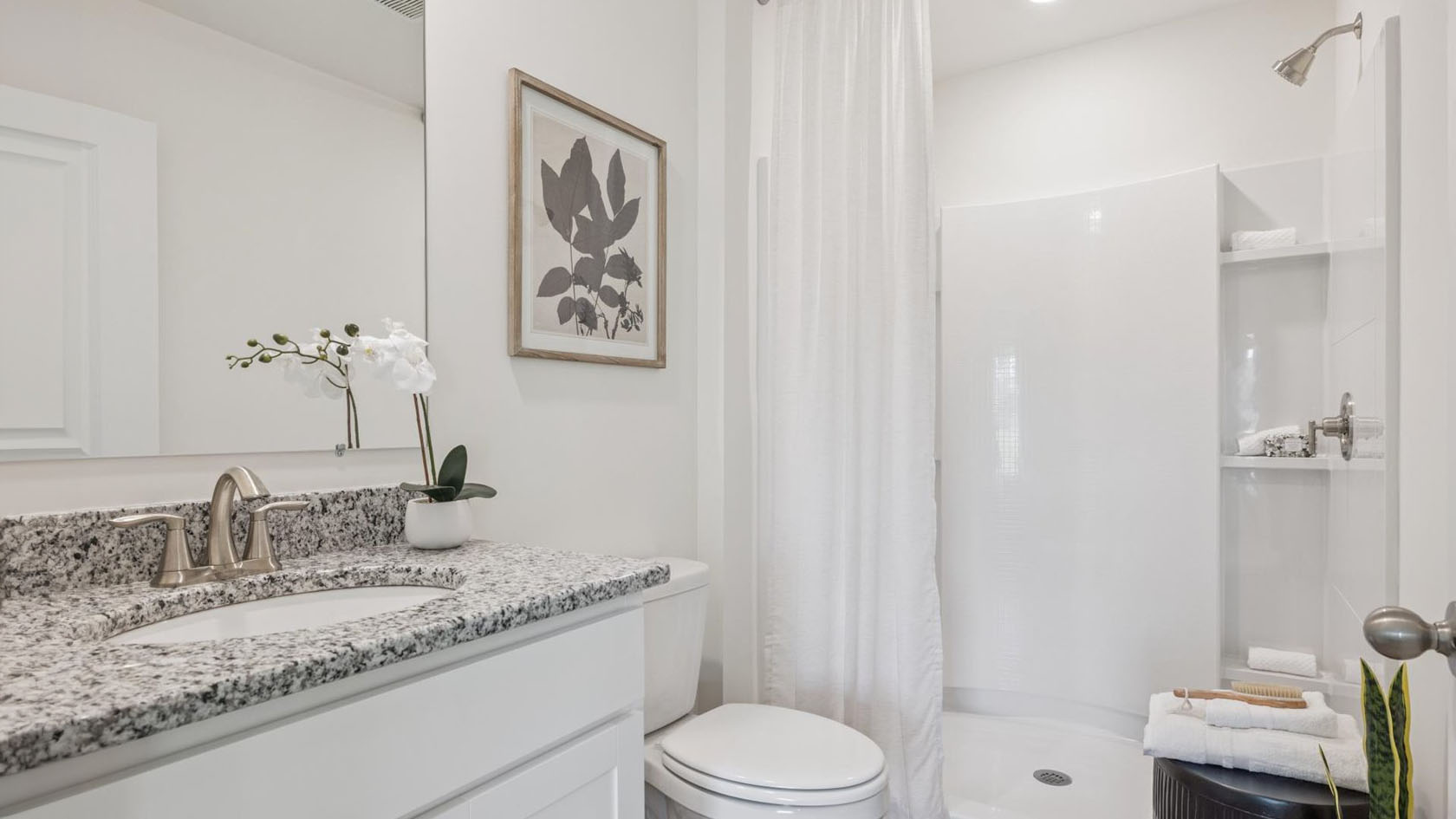 Primary bathroom with luxurious shower and built in storage