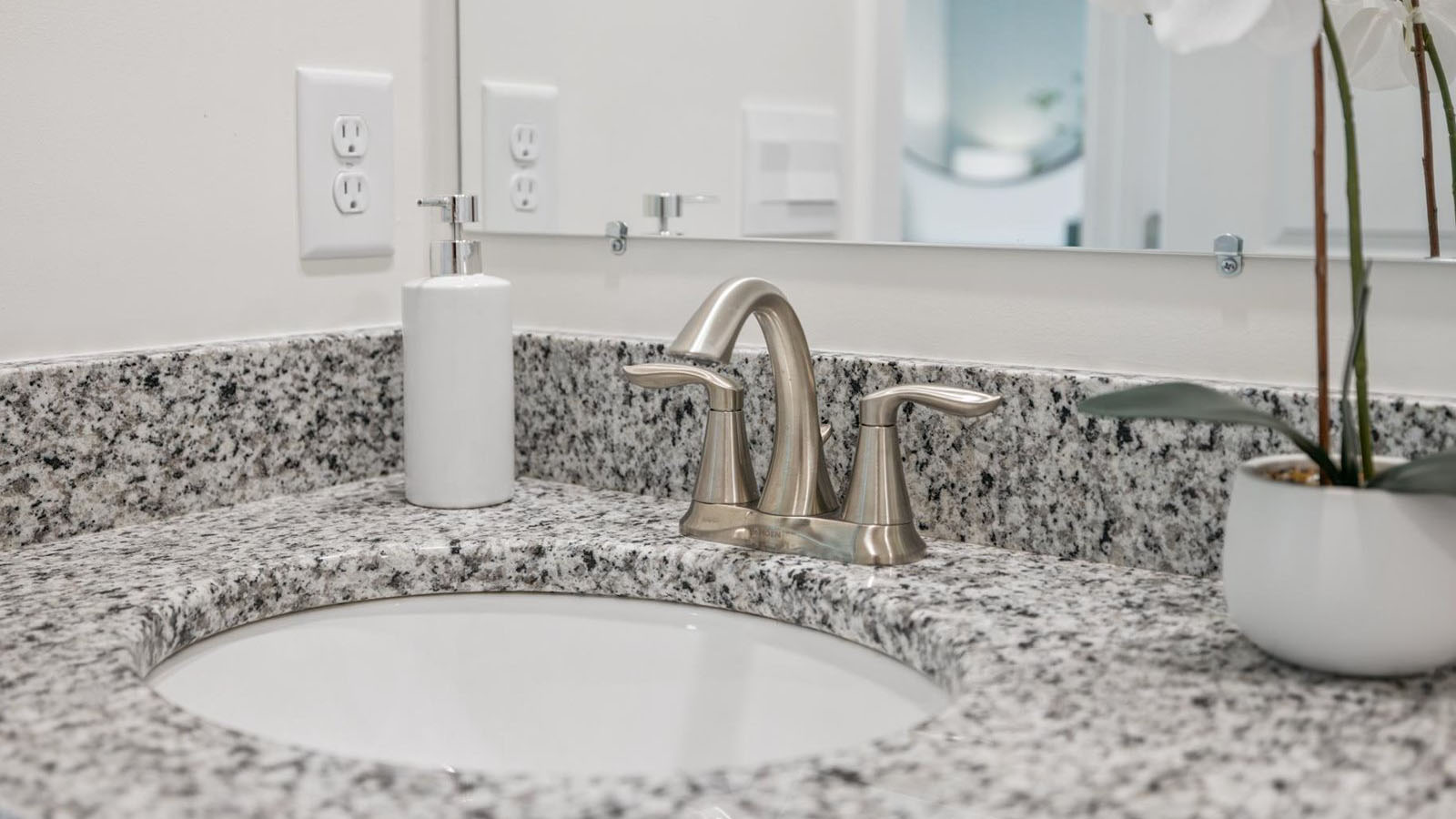 Private attached primary bathroom with built in vanity