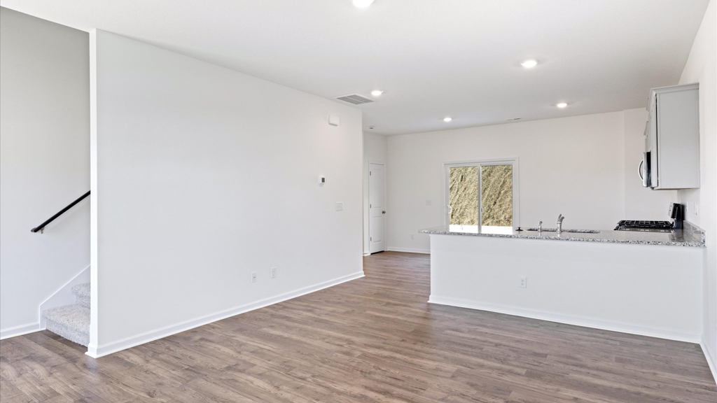 Spacious open concept kitchen with island and counter prep space