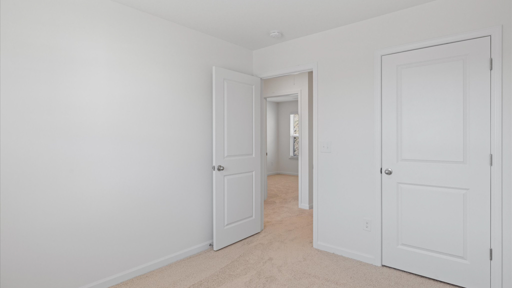 spacious bedroom overlooking the shared hallway