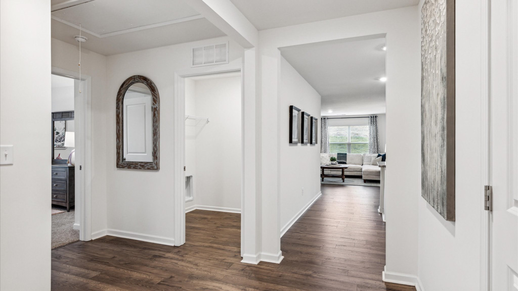 additional view of entry way to the left looking into laundry room