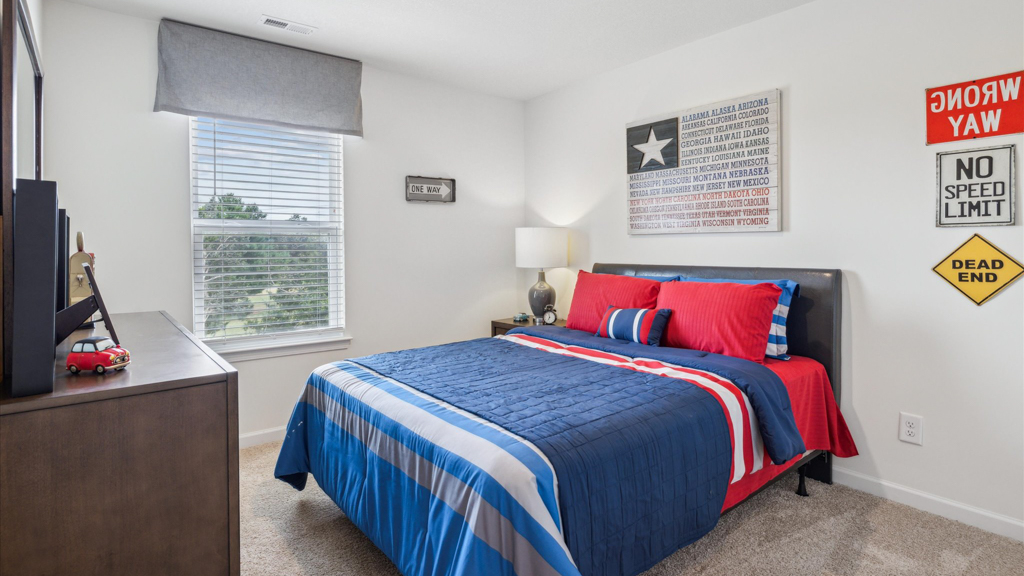 Bedroom with ample natural light and carpet floors