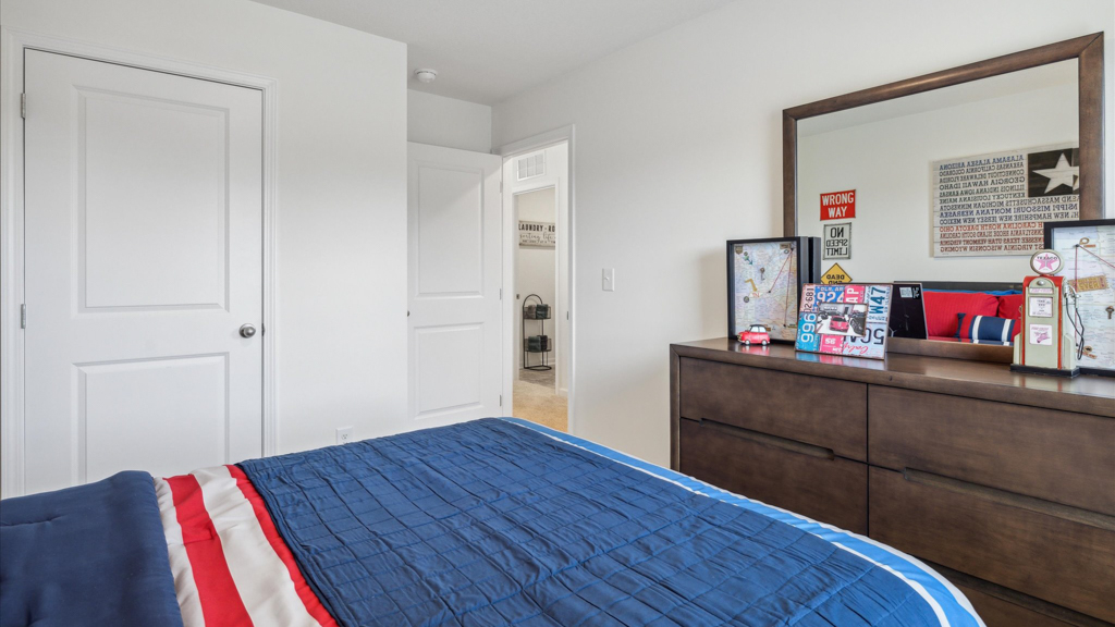 Bedroom with ample natural light and carpet floors