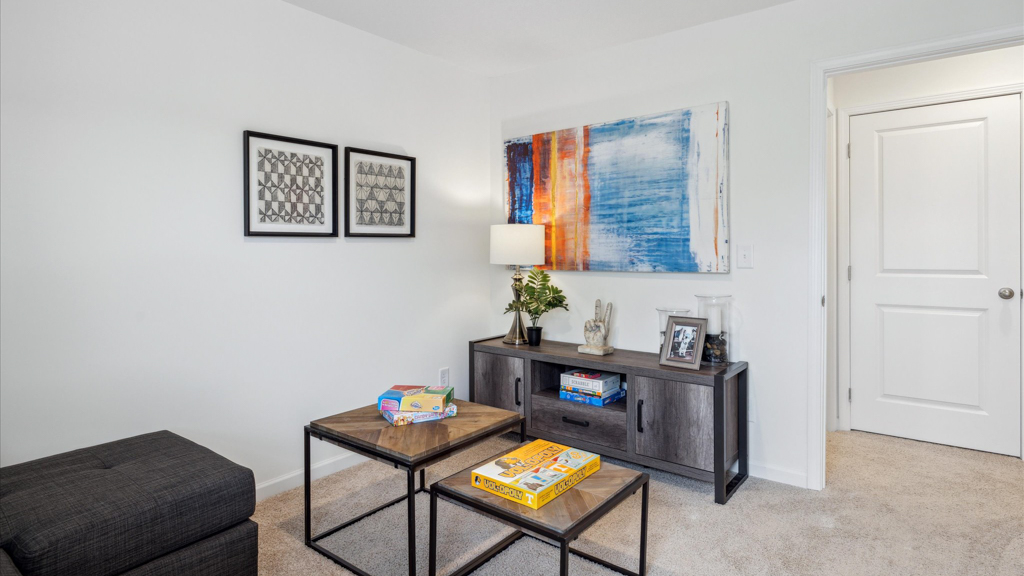 Bedroom with ample natural light and carpet floors