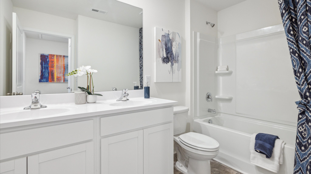 Upstairs bathroom with combination shower and bathtub