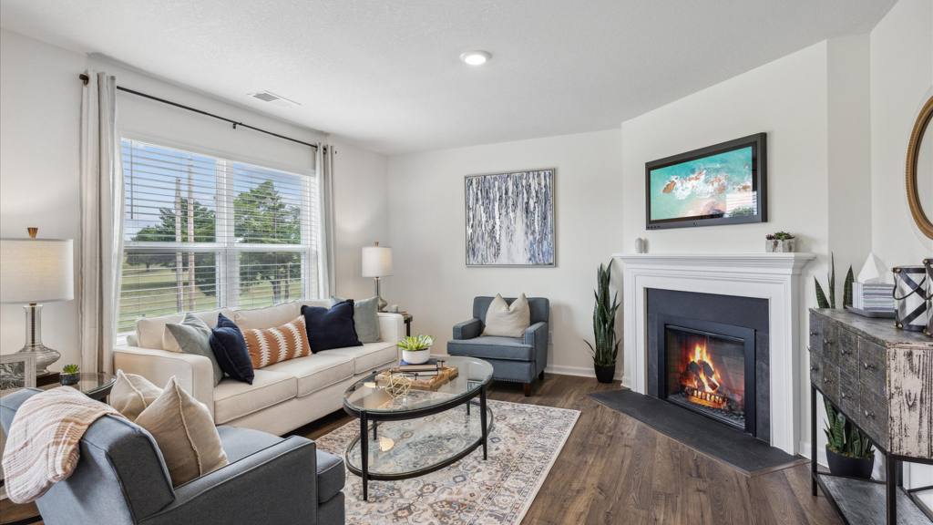 Spacious living and great  room space with light allowing windows