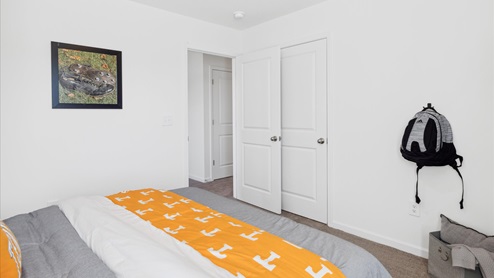 Bedroom staged as a room for a Tennessee football fan