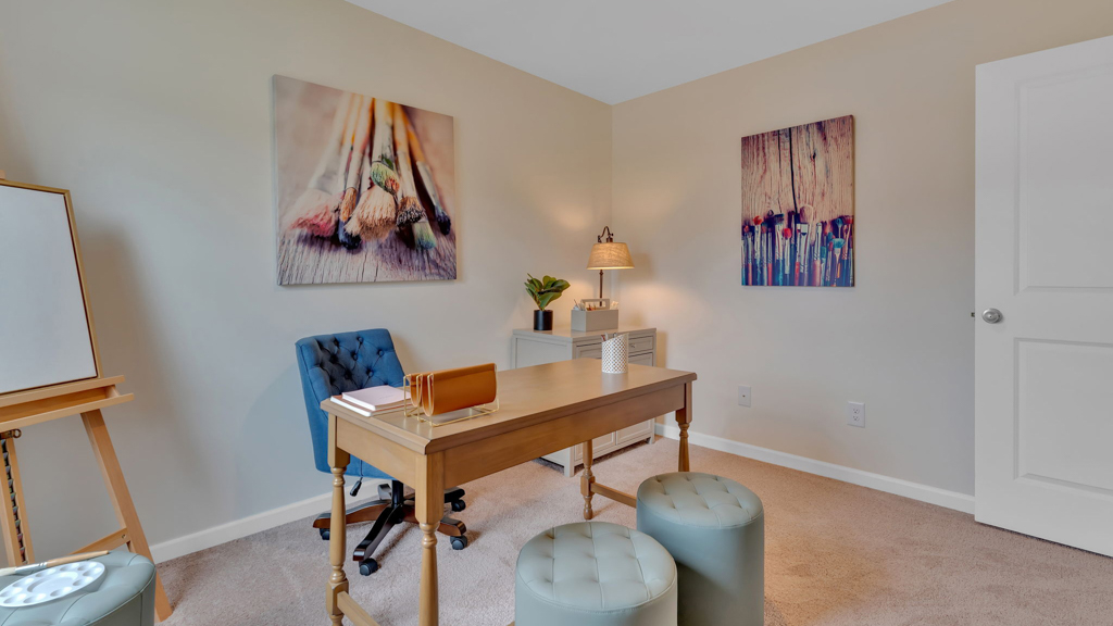 Bedroom with ample natural light and carpet floors