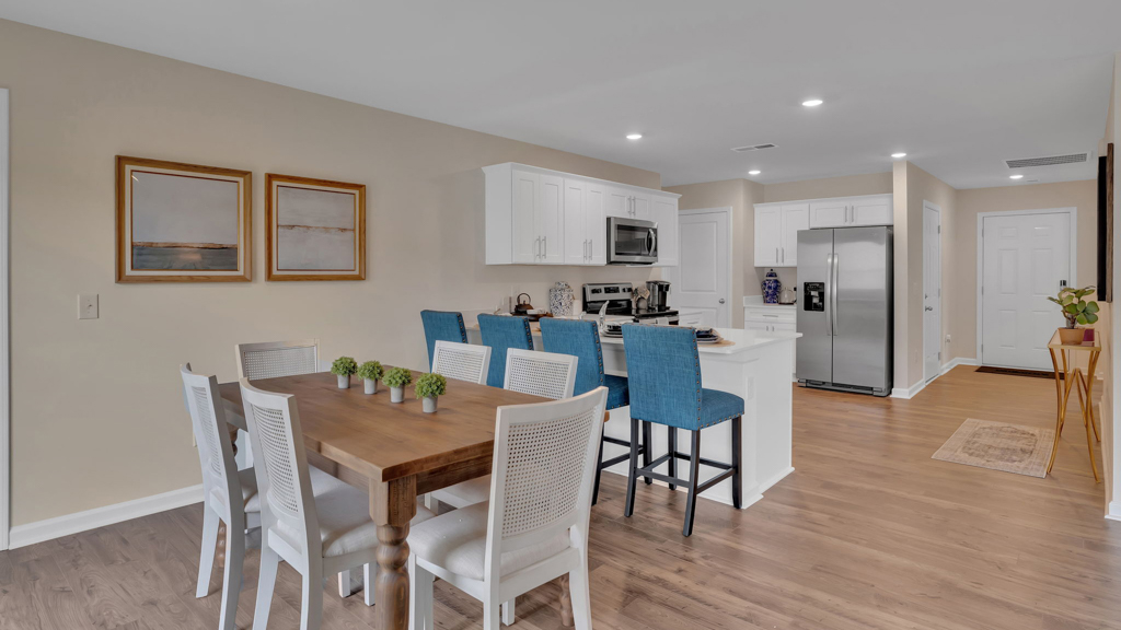 Open concept living, dining, and kitchen space