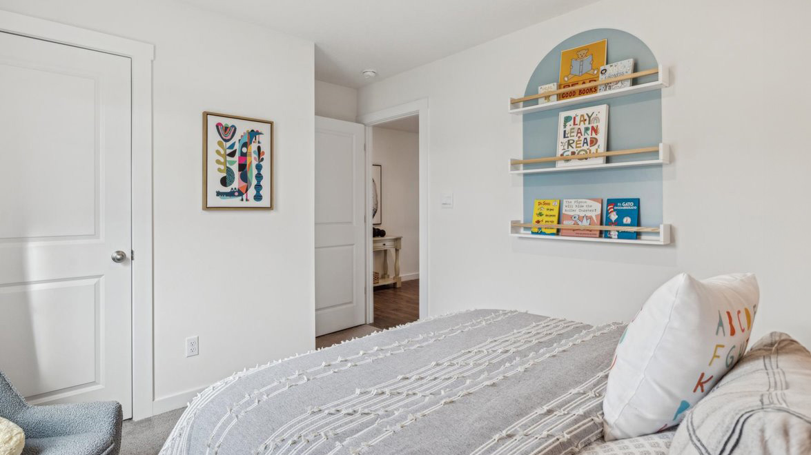 Bedroom with ample natural light and carpet floors