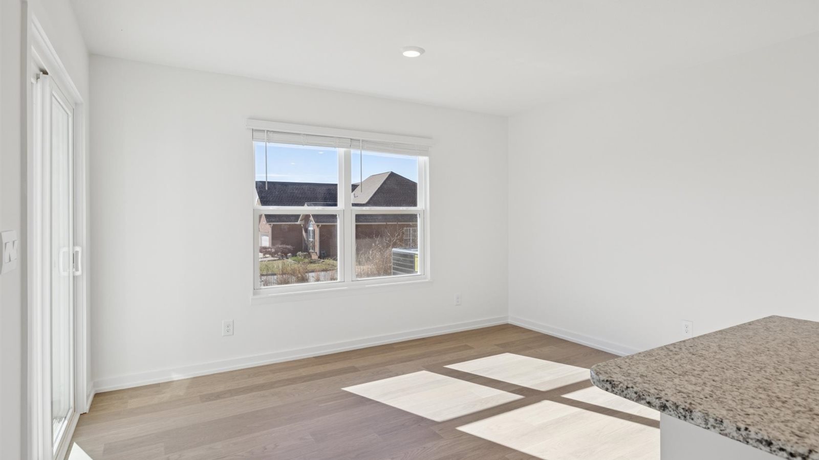 Open concept living, dining, and kitchen space