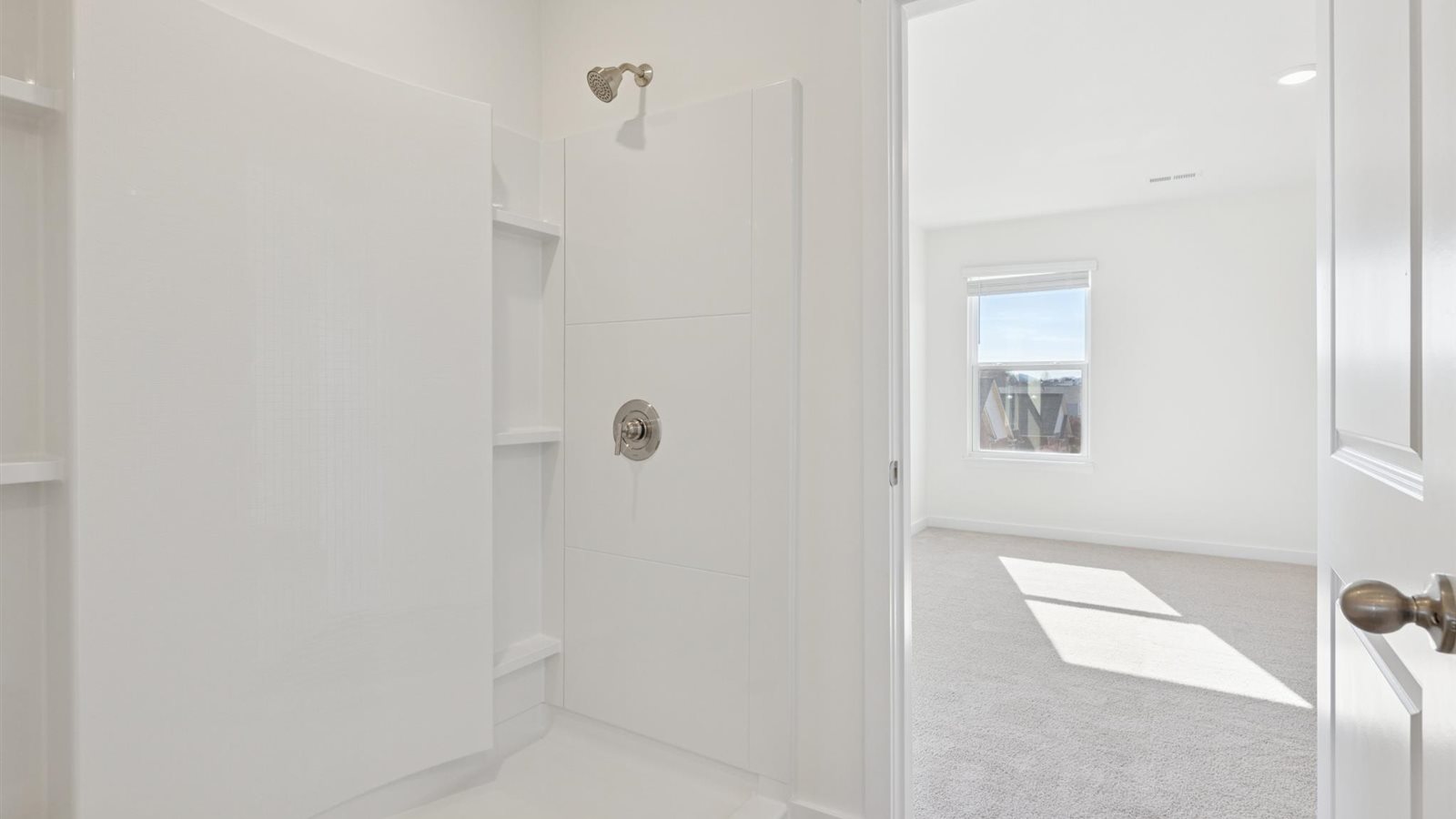 Primary bathroom with double vanity and walk-in shower