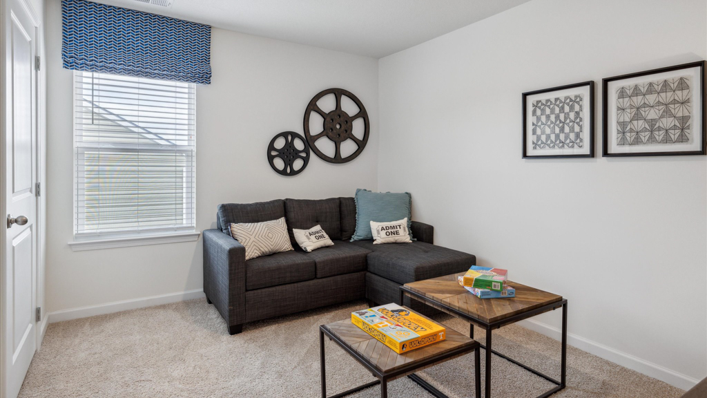 Bedroom with ample natural light and carpet floors