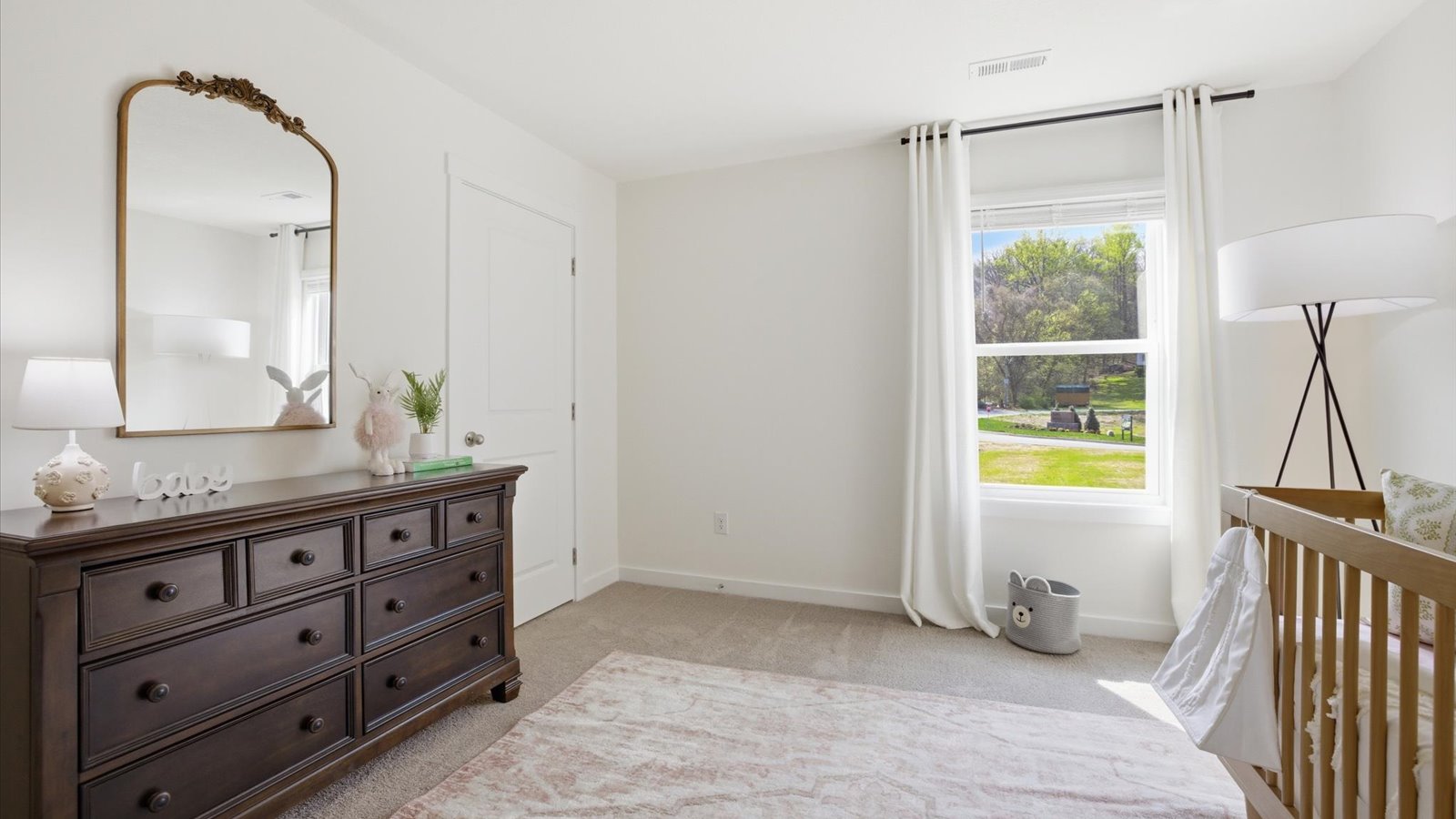 Bedroom with ample natural light and carpet floors
