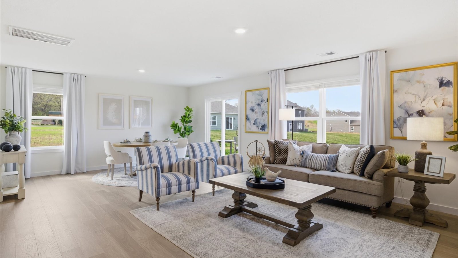 Open concept living, dining, and kitchen space