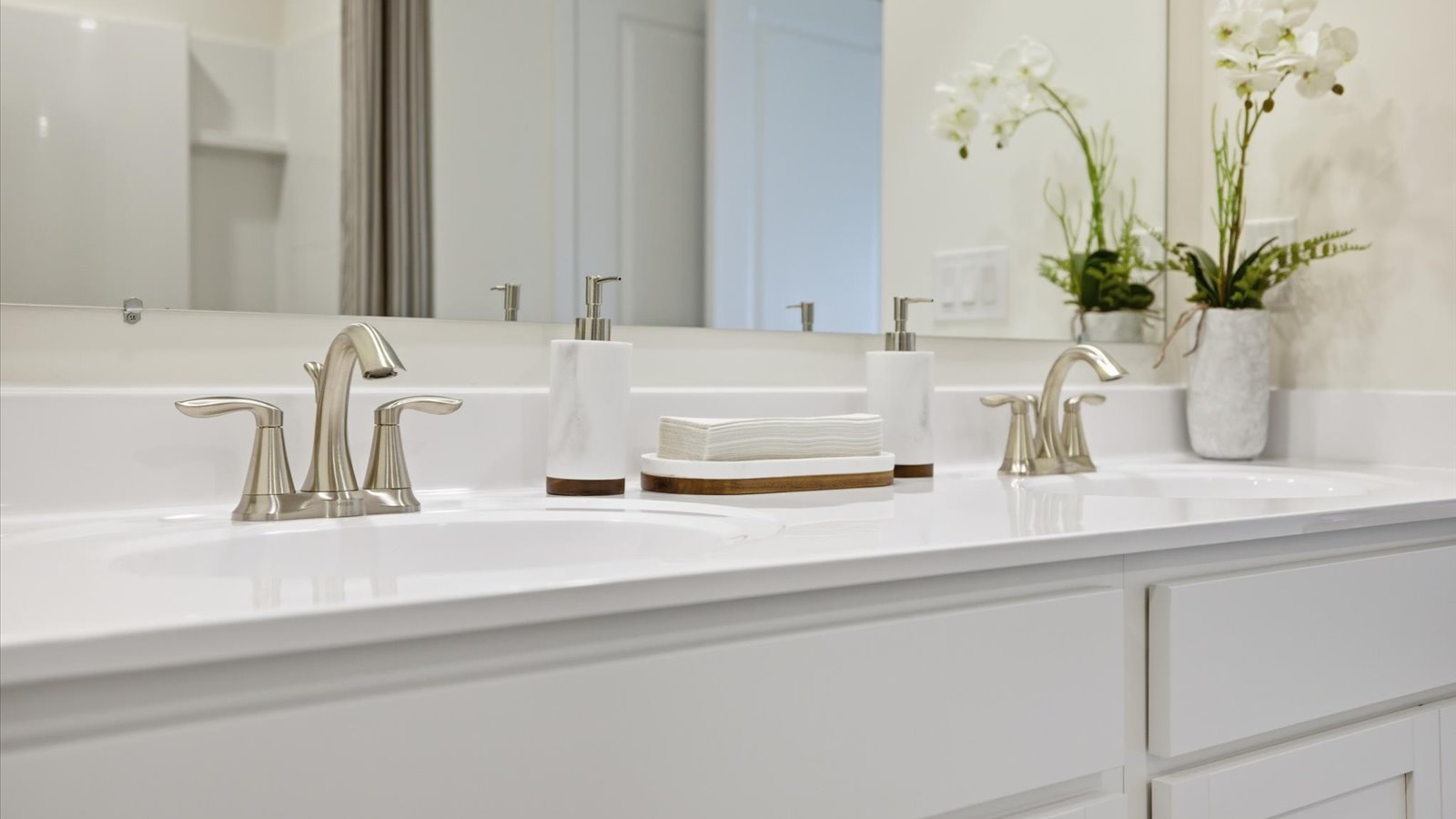 Primary bathroom with double vanity and walk-in shower