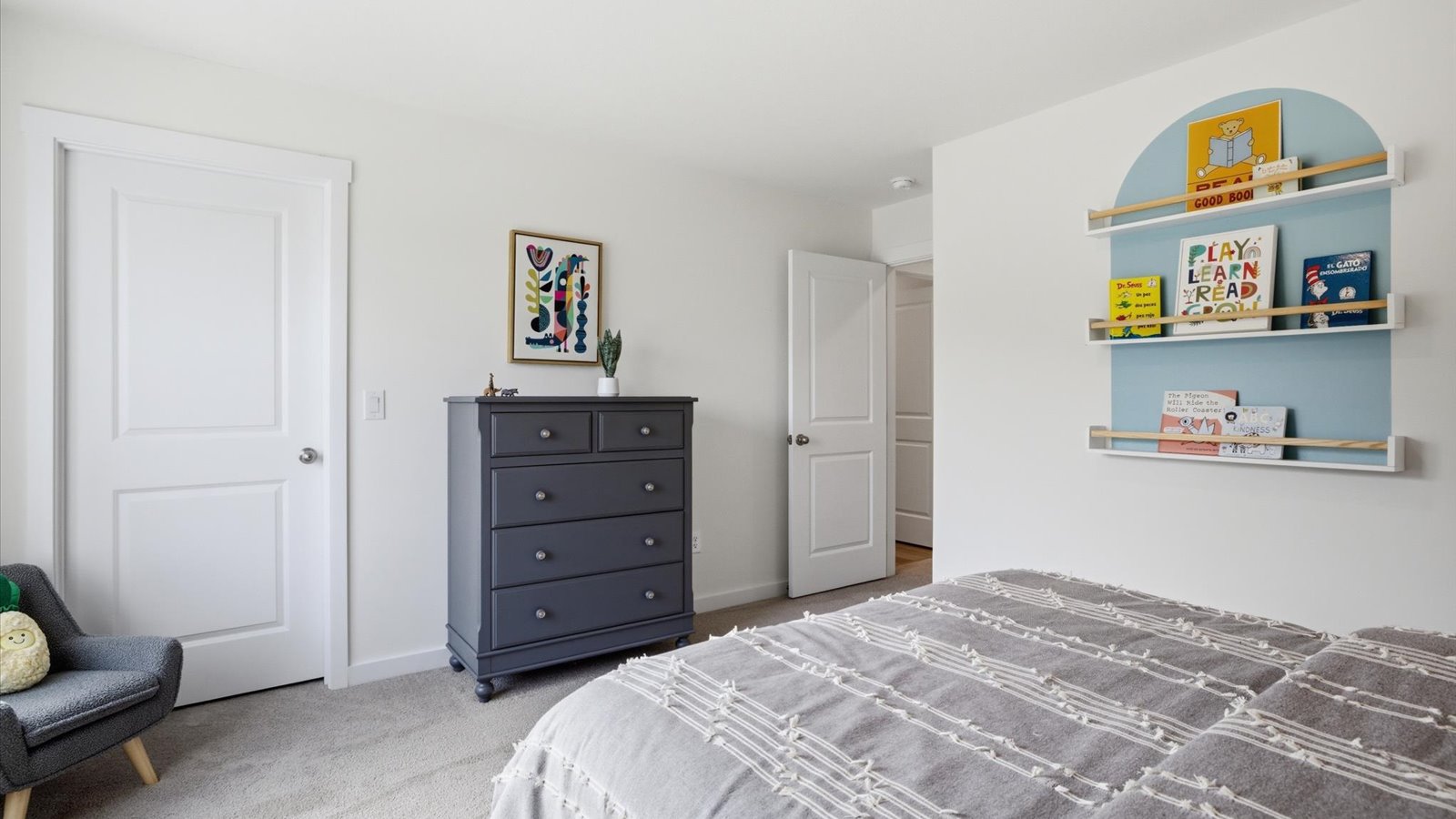 Bedroom with ample natural light and carpet floors