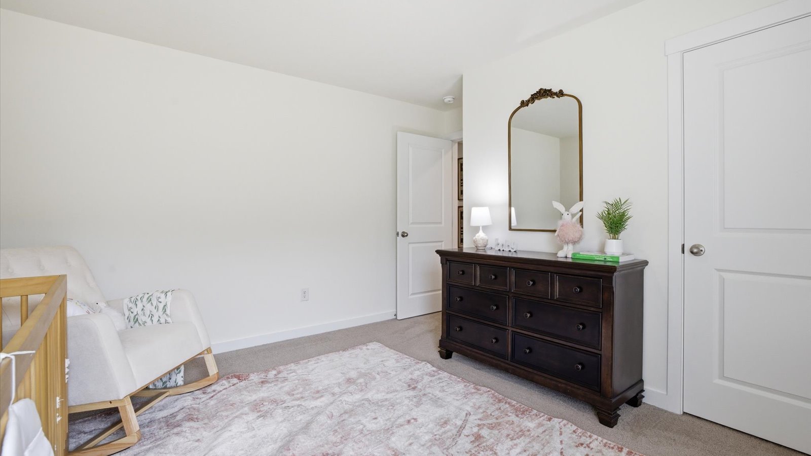 Bedroom with ample natural light and carpet floors